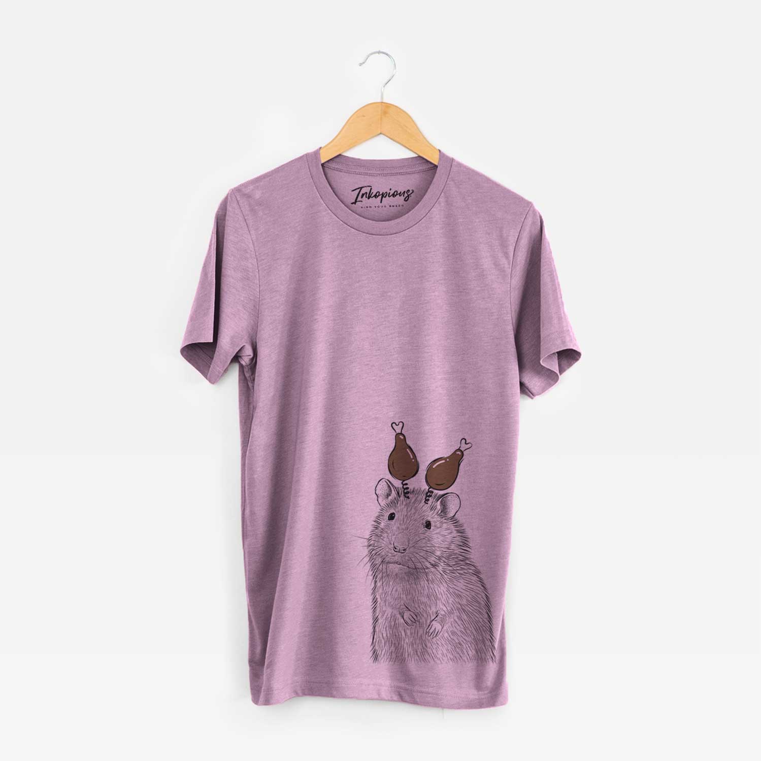 Hand-drawn sketch of Rizzo the Rat with a Thanksgiving turkey headpiece on an Orchid Unisex crewneck