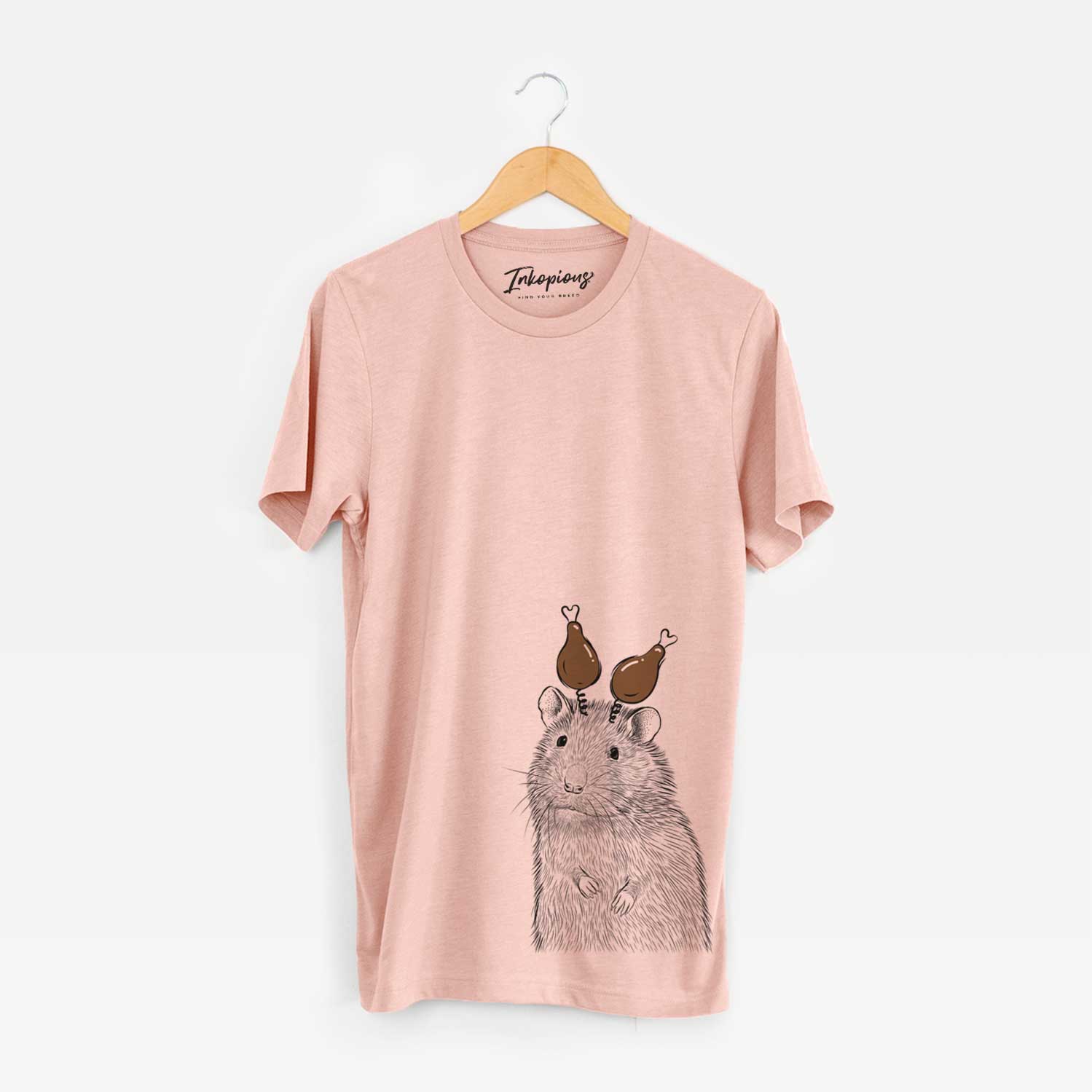 Hand-drawn sketch of Rizzo the Rat with a Thanksgiving turkey headpiece on a Peach Unisex crewneck