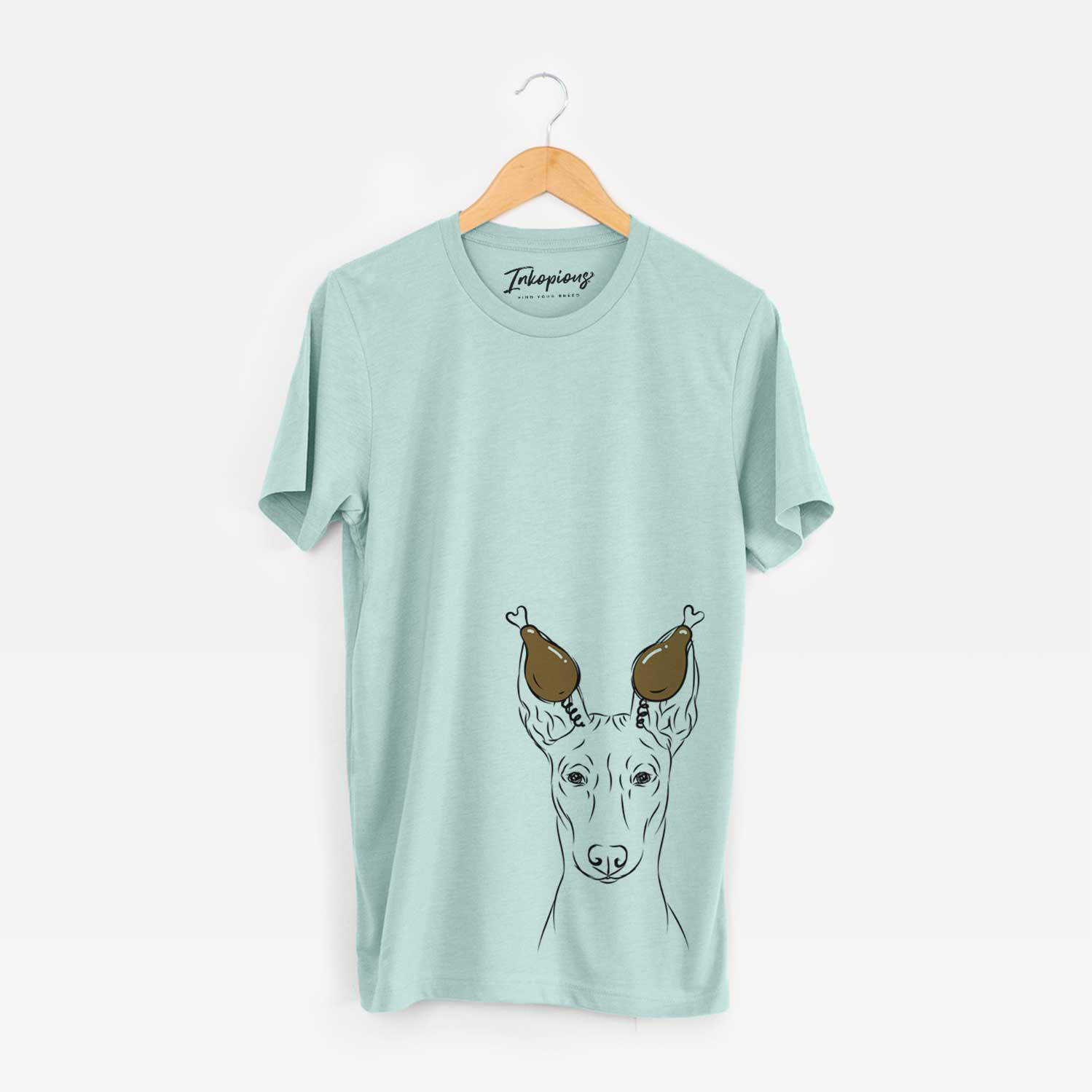 Hand-drawn sketch of Ruadh the Pharaoh Hound with a Thanksgiving turkey headpiece on a Heather Sage Unisex crewneck