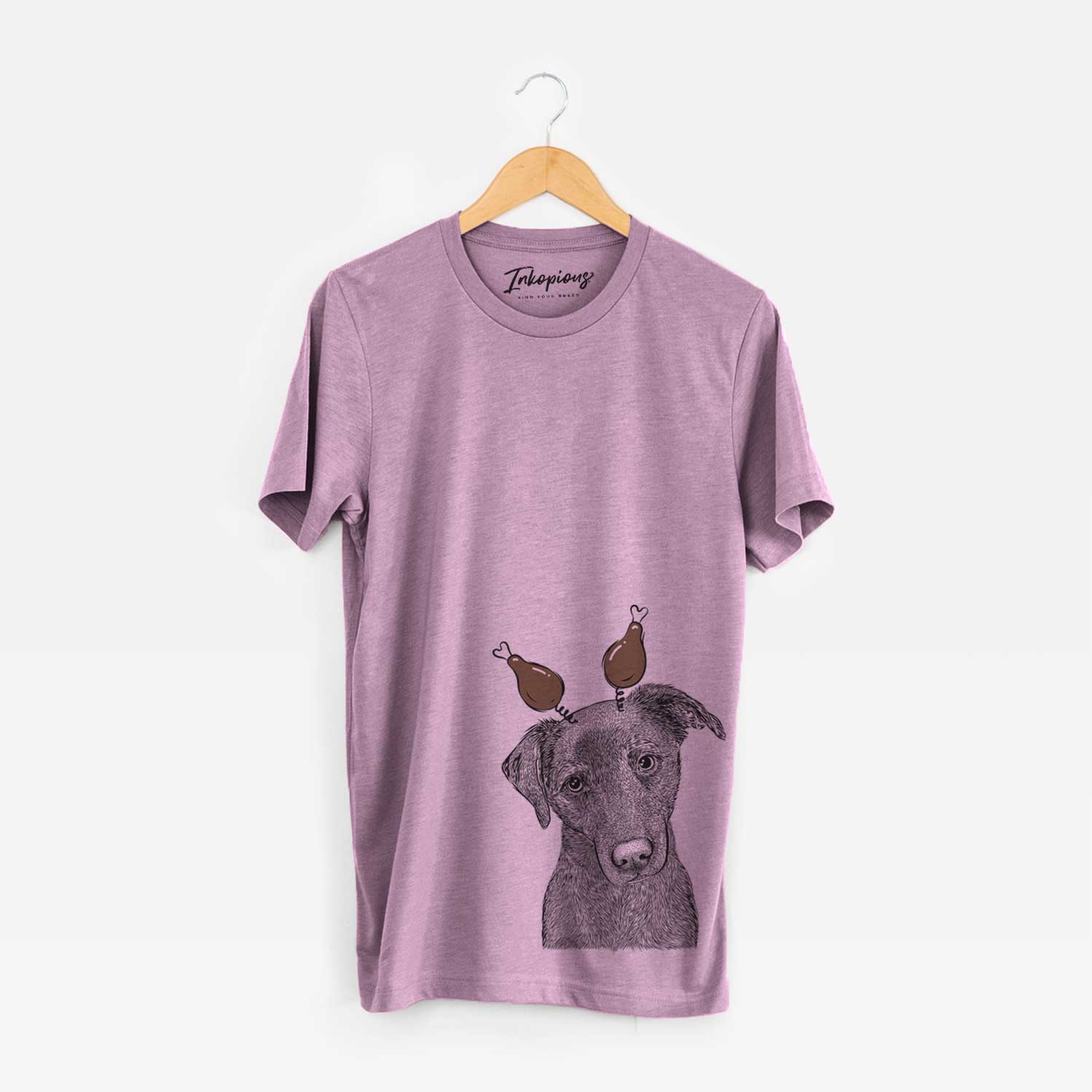 Hand-drawn sketch of Sadie the Whipador with a Thanksgiving turkey headpiece on an Orchid Unisex crewneck