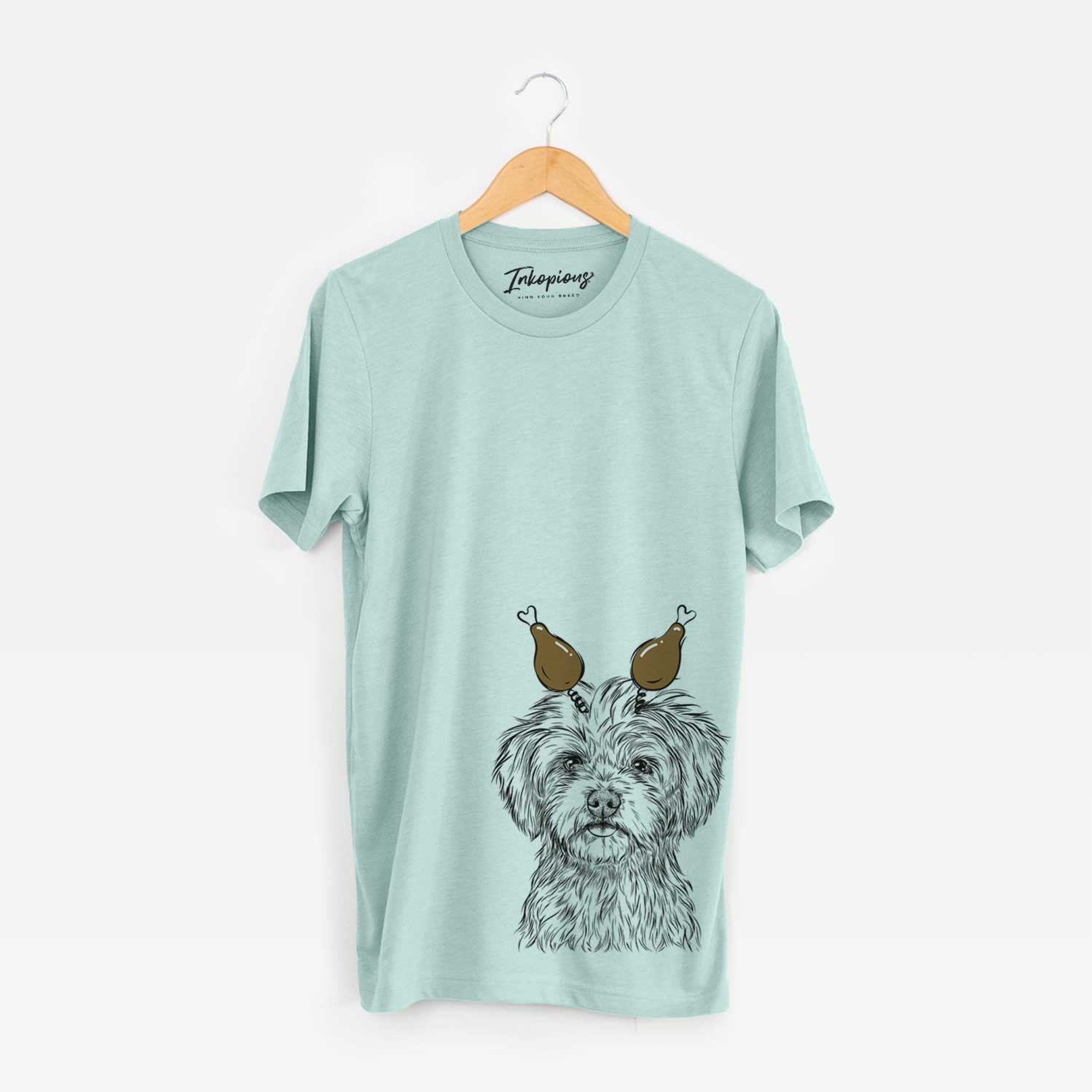 Hand-drawn sketch of Sammy the Shorkie with a Thanksgiving turkey headpiece on a Heather Sage Unisex crewneck