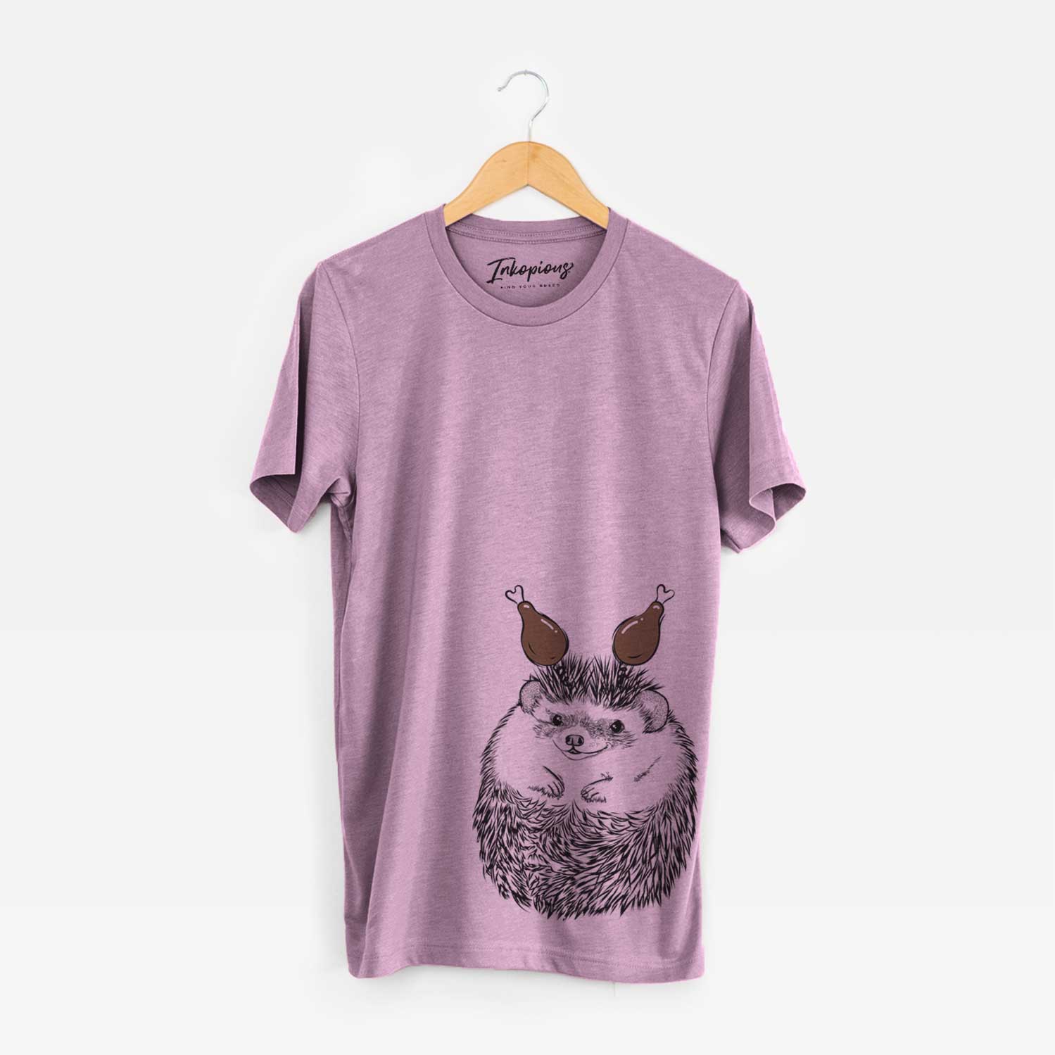 Hand-drawn sketch of Sid the Hedgehog with a Thanksgiving turkey headpiece on an Orchid Unisex crewneck