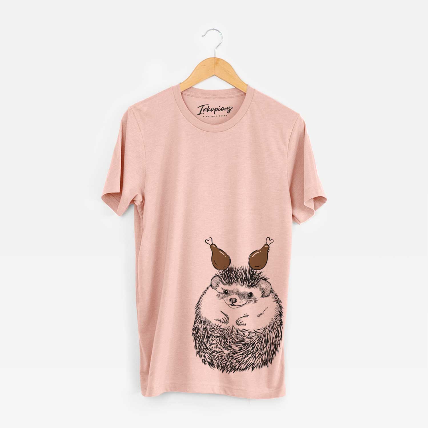Hand-drawn sketch of Sid the Hedgehog with a Thanksgiving turkey headpiece on a Peach Unisex crewneck