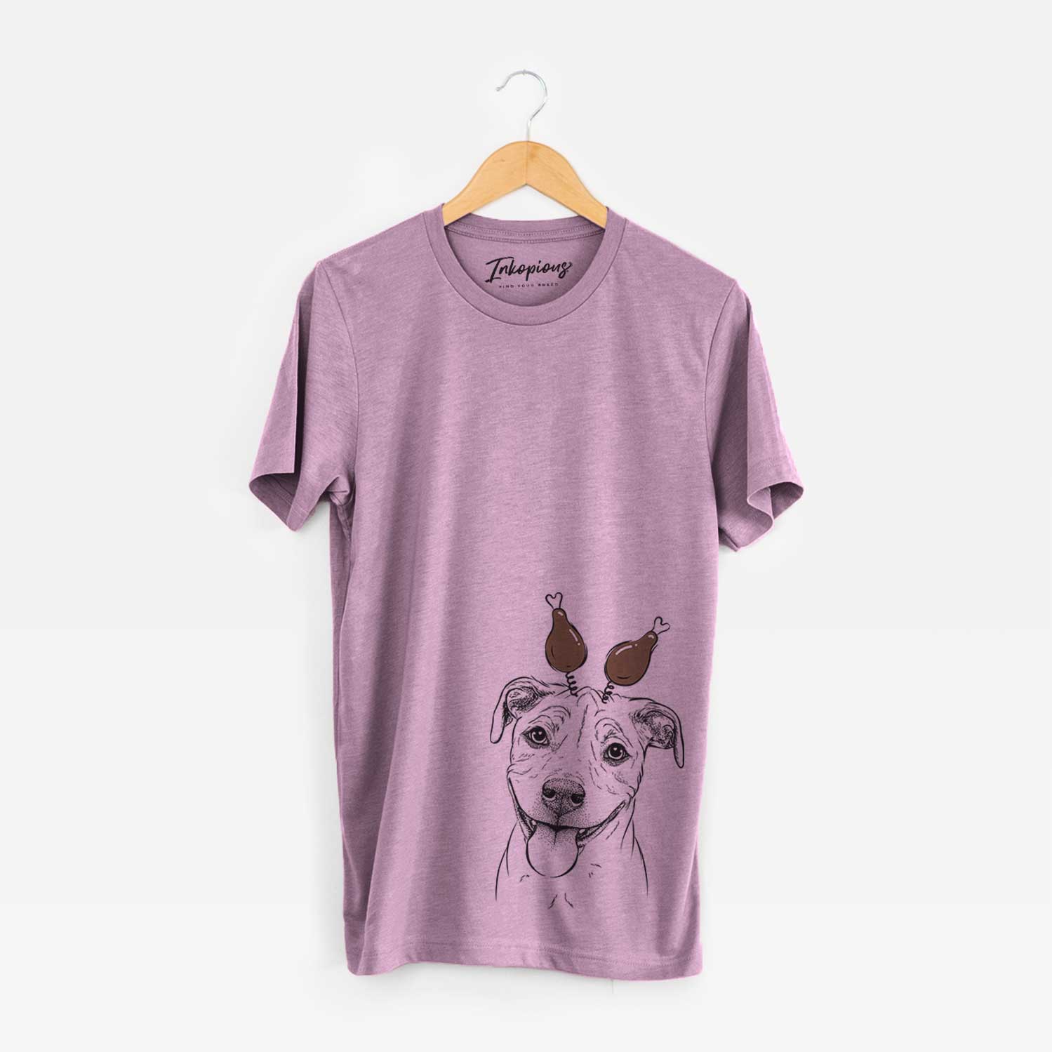 Hand-drawn sketch of Skye the Pitweiler with a Thanksgiving turkey headpiece on an Orchid Unisex crewneck