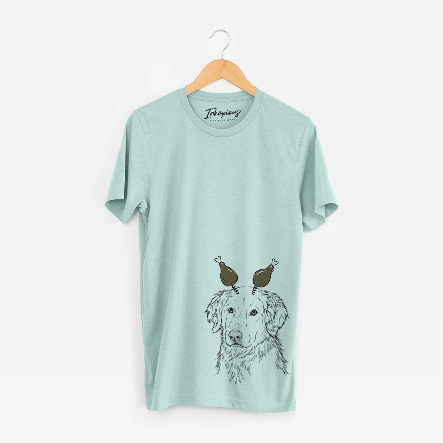 Hand-drawn sketch of Spencer the Golden Retriever with a Thanksgiving turkey headpiece on a Heather Sage Unisex crewneck