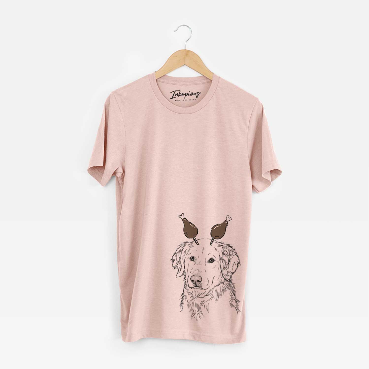 Hand-drawn sketch of Spencer the Golden Retriever with a Thanksgiving turkey headpiece on a Peach Unisex crewneck