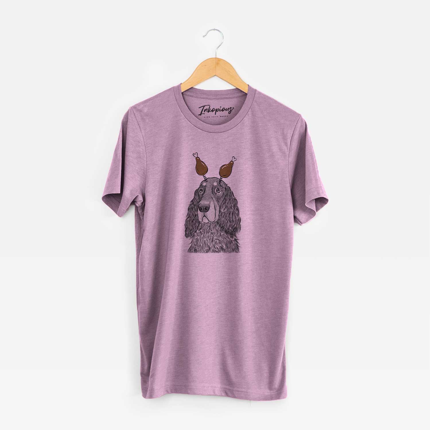 Hand-drawn sketch of Stormy the Gordon Setter with a Thanksgiving turkey headpiece on an Orchid Unisex crewneck