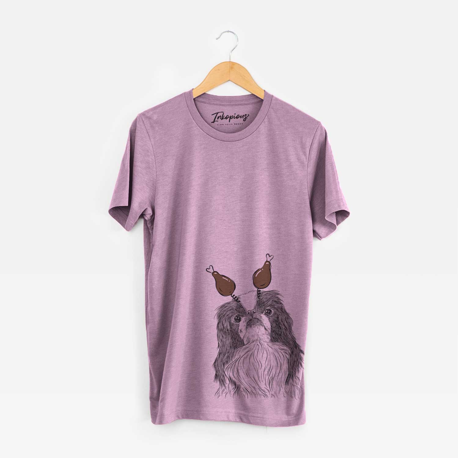 Hand-drawn sketch of Suki the Japanese Chin with a Thanksgiving turkey headpiece on an Orchid Unisex crewneck