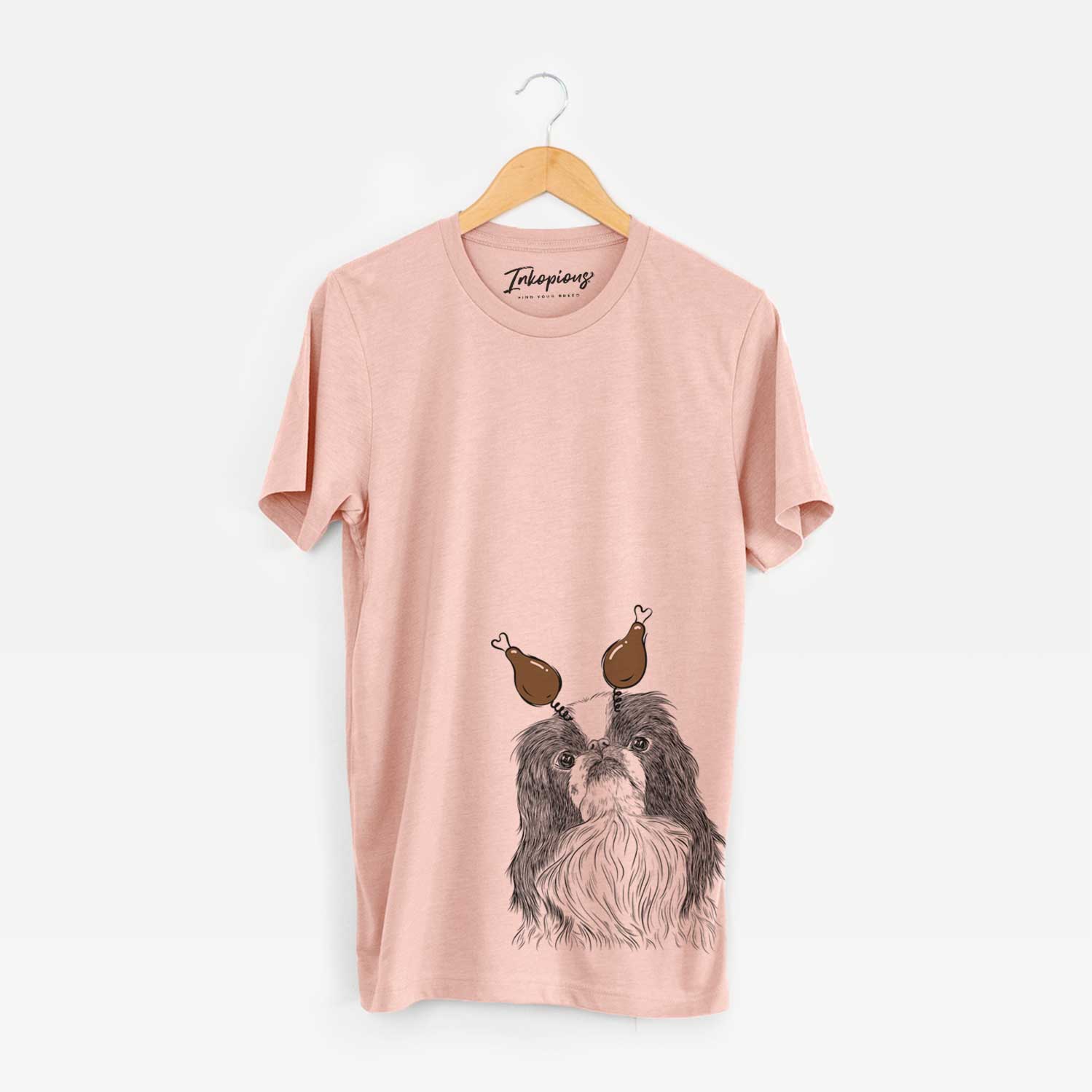 Hand-drawn sketch of Suki the Japanese Chin with a Thanksgiving turkey headpiece on a Peach Unisex crewneck