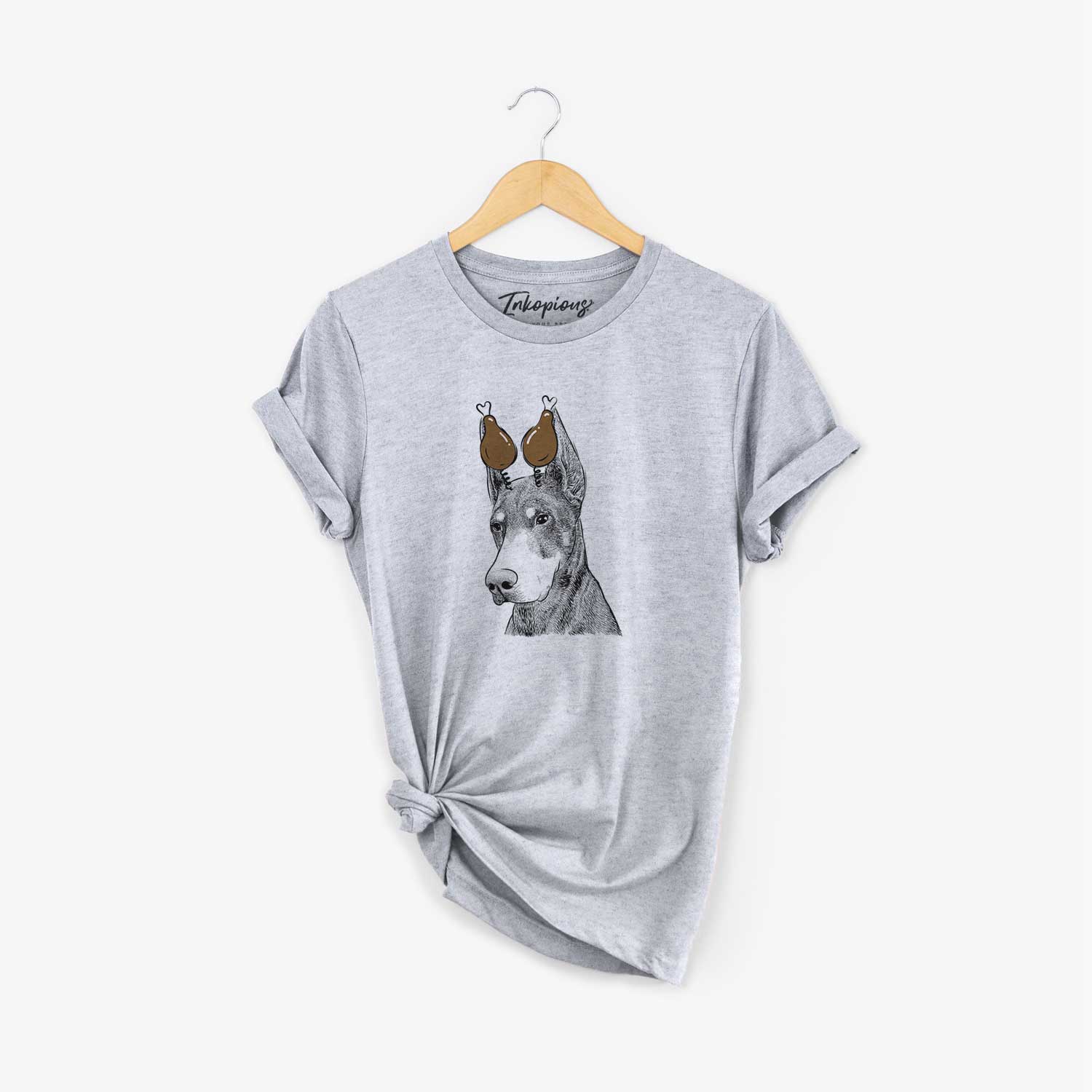 Hand-drawn sketch of Sunny the Doberman Pinscher with a Thanksgiving turkey headpiece on a Grey Unisex crewneck