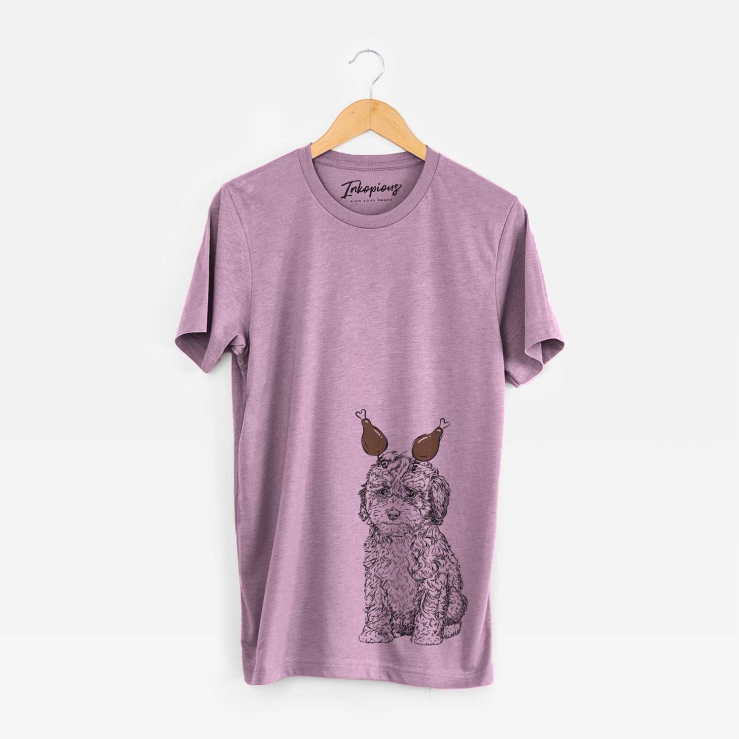 Hand-drawn sketch of Sweet Tea the Mini Doodle with a Thanksgiving turkey headpiece on an Orchid Unisex crewneck
