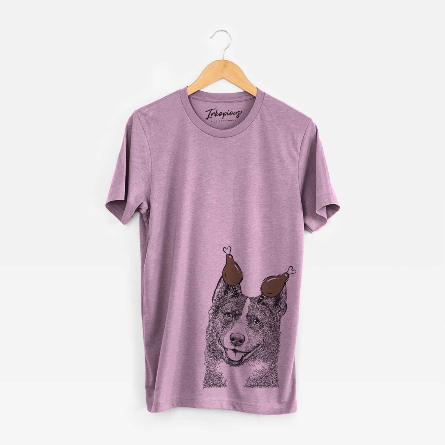 Hand-drawn sketch of Tosca the Karelian Bear Dog with a Thanksgiving turkey headpiece on an Orchid Unisex crewneck