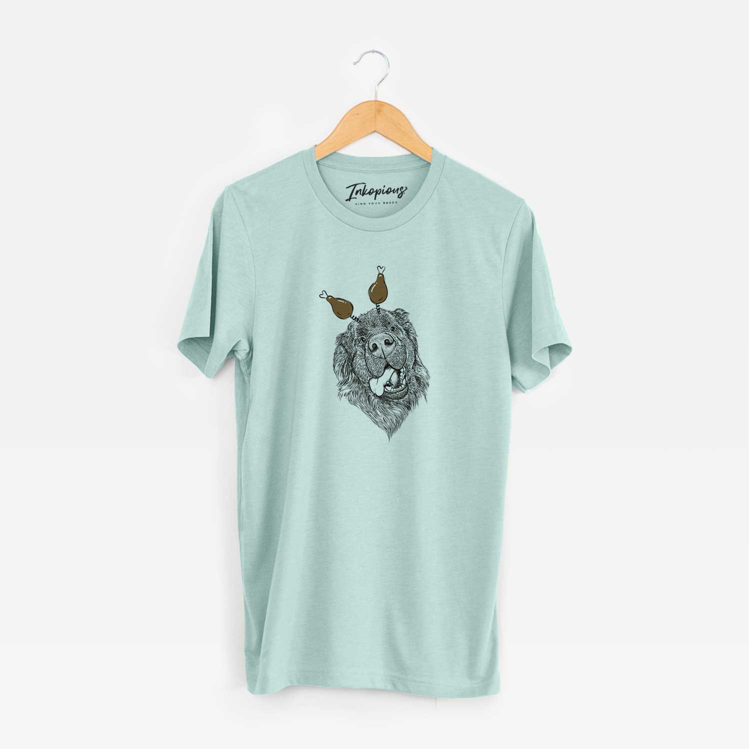 Hand-drawn sketch of Tuna the Newfoundland with a Thanksgiving turkey headpiece on a Heather Sage Unisex crewneck