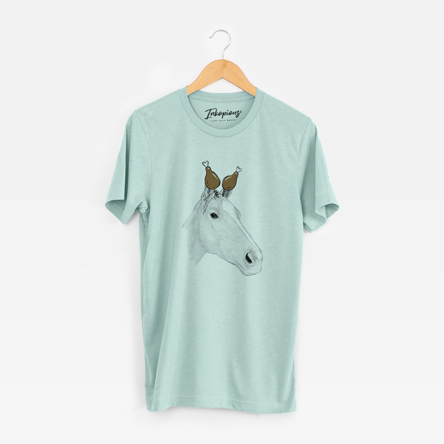 Hand-drawn sketch of Westley the Horse with a Thanksgiving turkey headpiece on a Heather Sage Unisex crewneck