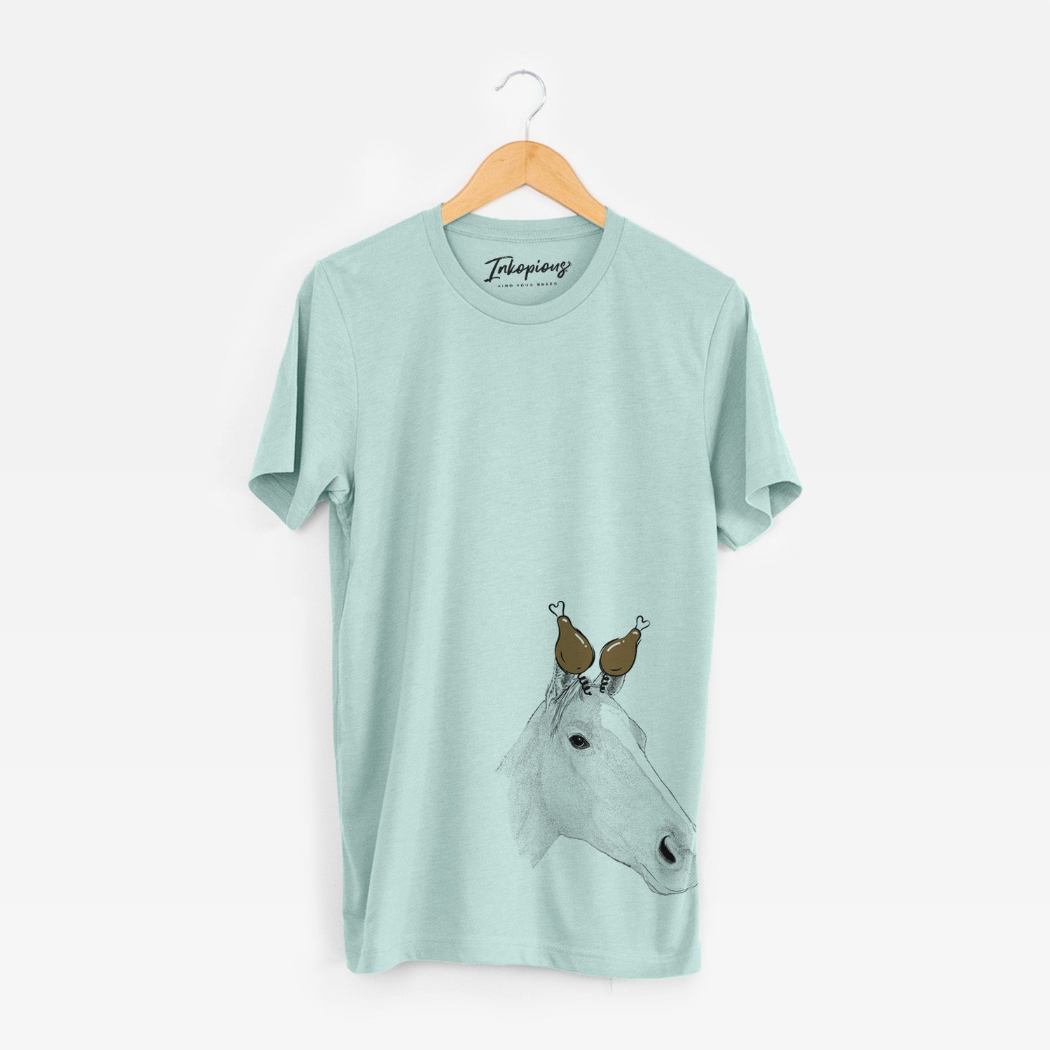 Hand-drawn sketch of Westley the Horse with a Thanksgiving turkey headpiece on a Heather Sage Unisex crewneck