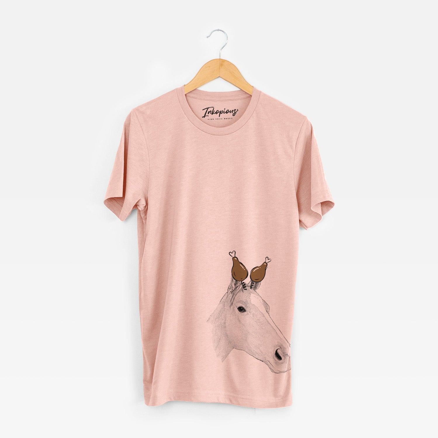 Hand-drawn sketch of Westley the Horse with a Thanksgiving turkey headpiece on a Peach Unisex crewneck