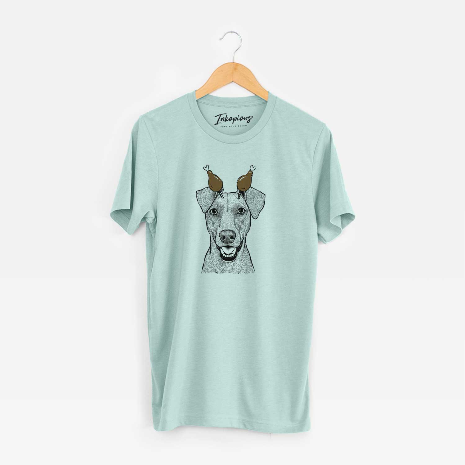 Hand-drawn sketch of Willow the German Pinscher with a Thanksgiving turkey headpiece on a Heather Sage Unisex crewneck