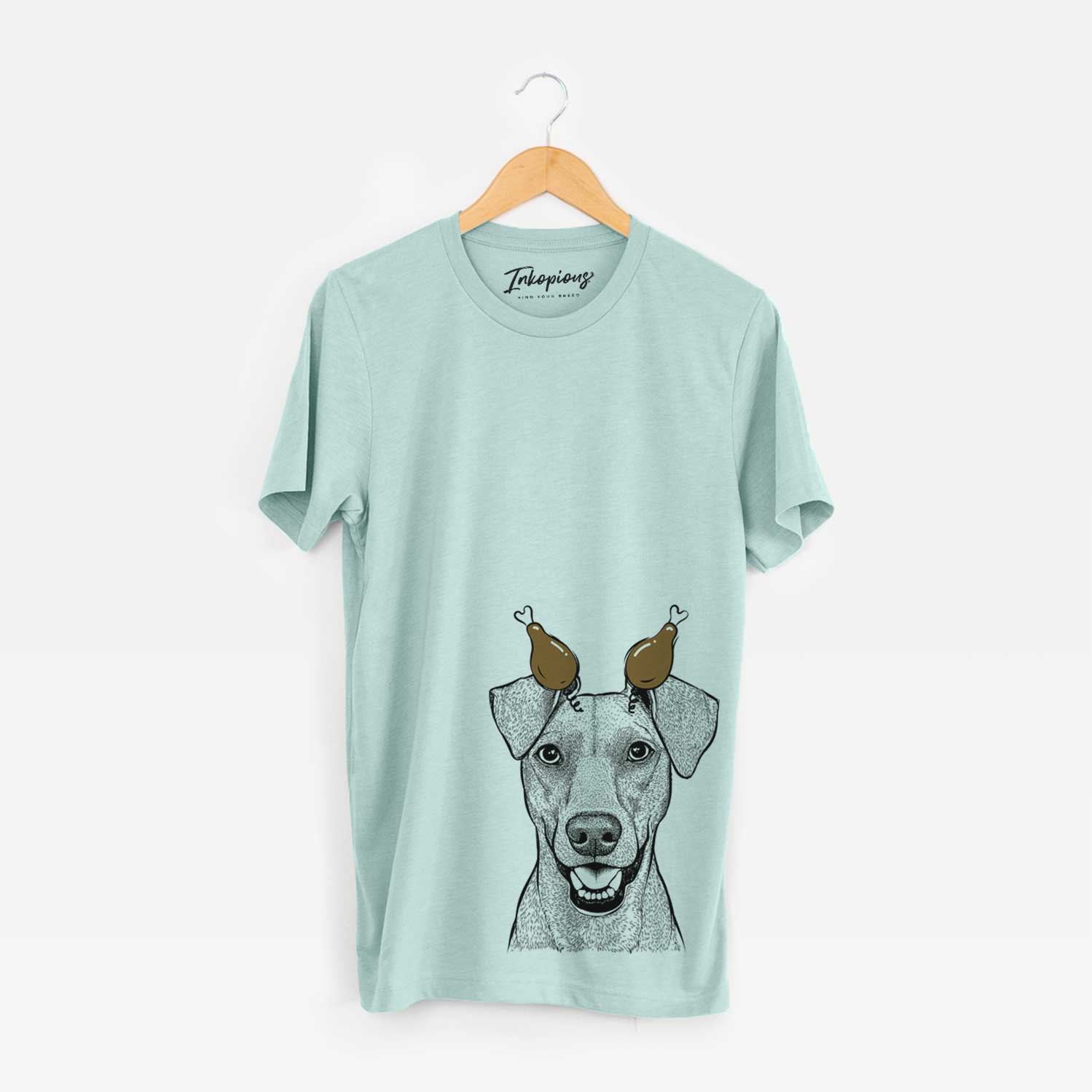 Hand-drawn sketch of Willow the German Pinscher with a Thanksgiving turkey headpiece on a Heather Sage Unisex crewneck