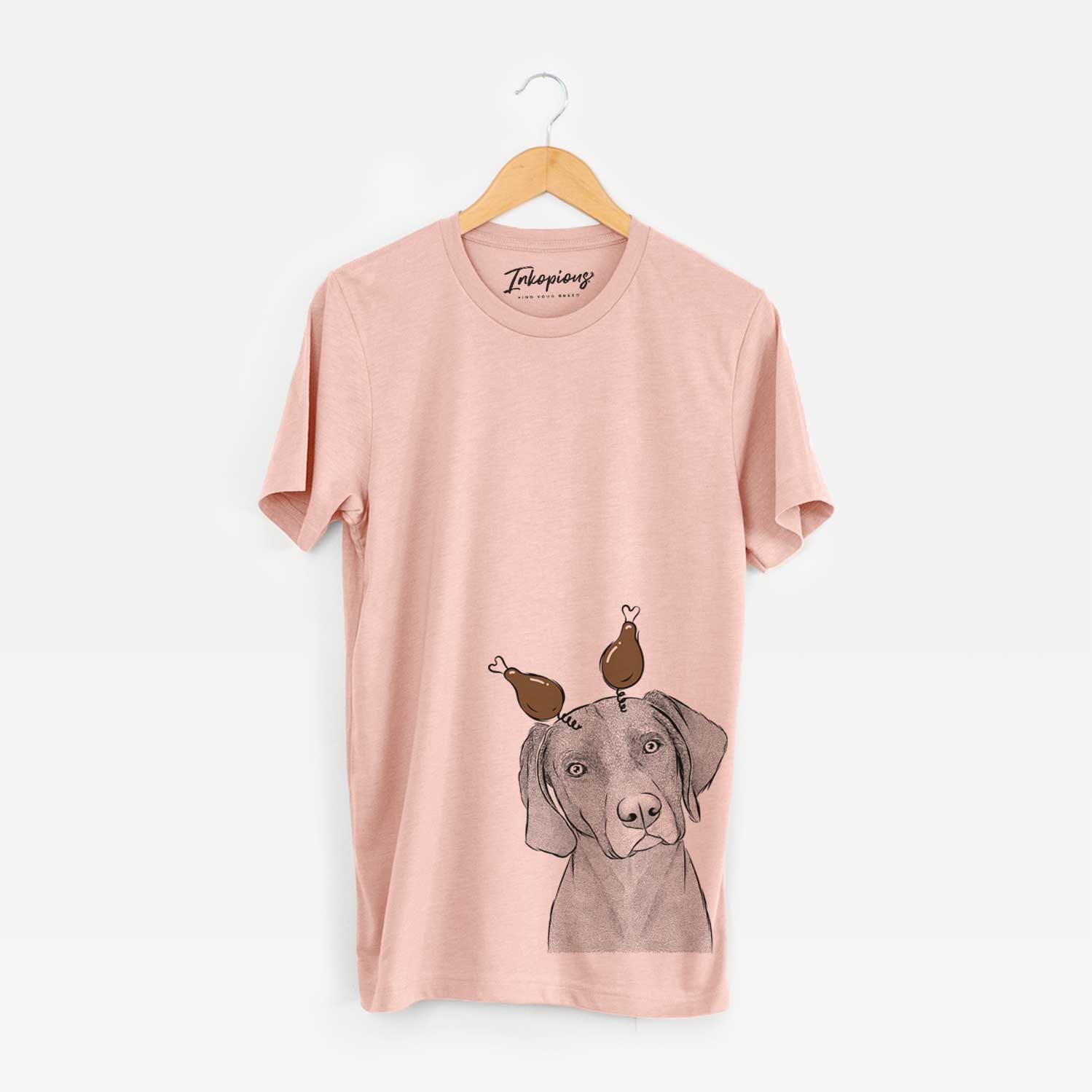 Hand-drawn sketch of Willow the Weizsla with a Thanksgiving turkey headpiece on a Peach Unisex crewneck