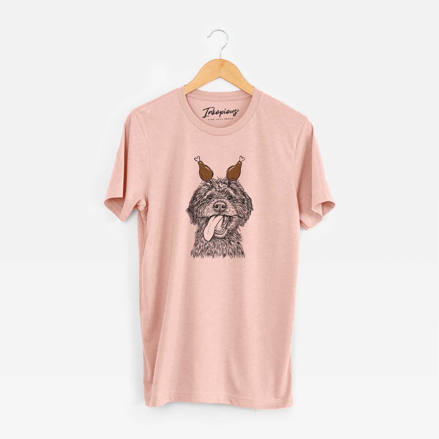 Hand-drawn sketch of Winnie the Mini Aussiedoodle with a Thanksgiving turkey headpiece on a Peach Unisex crewneck