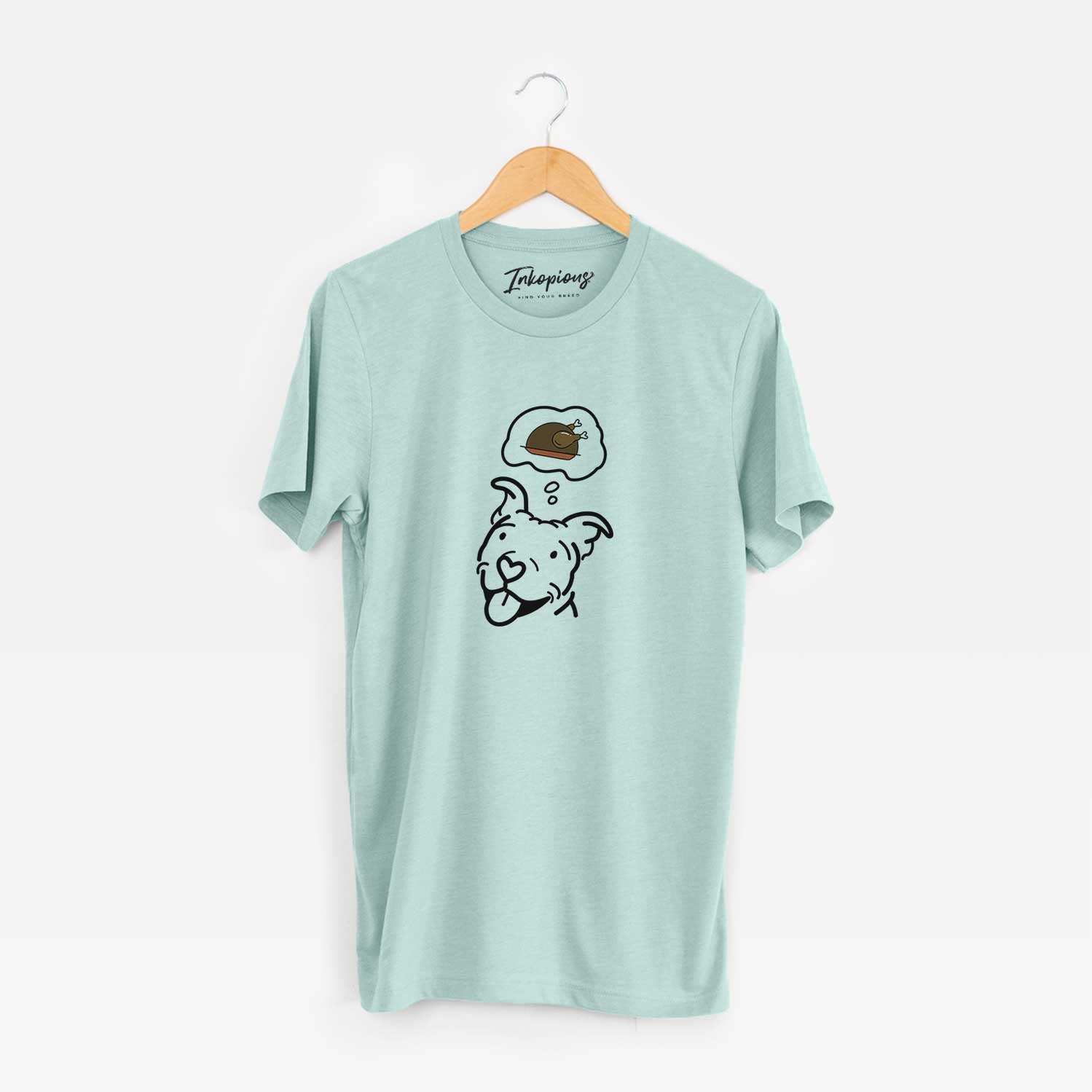 Minimalist line drawing of Arlo the Pitbull with a little turkey on a Heather Sage Unisex crewneck