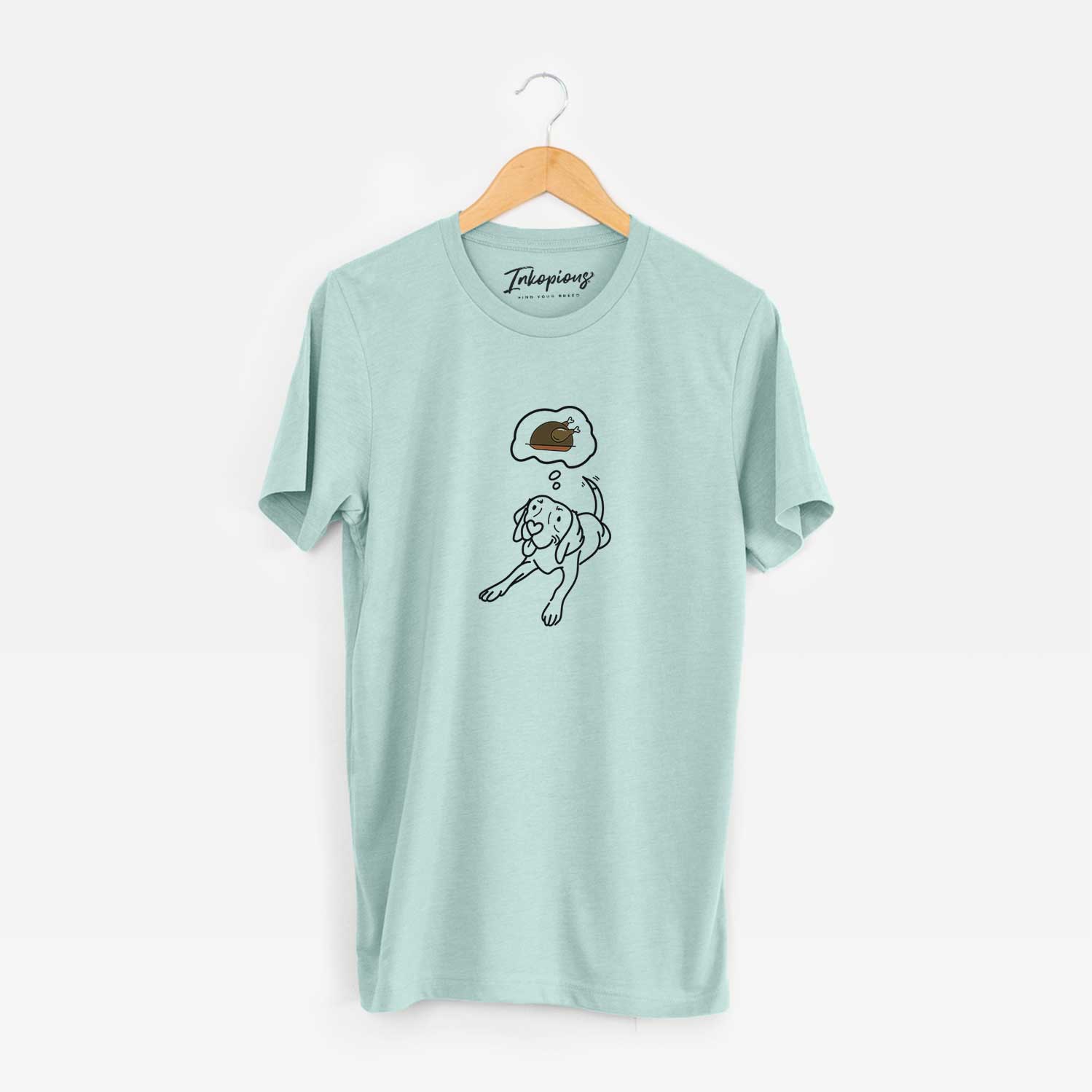 Minimalist line drawing of Bagel the Beagle with a little turkey on a Heather Sage Unisex crewneck