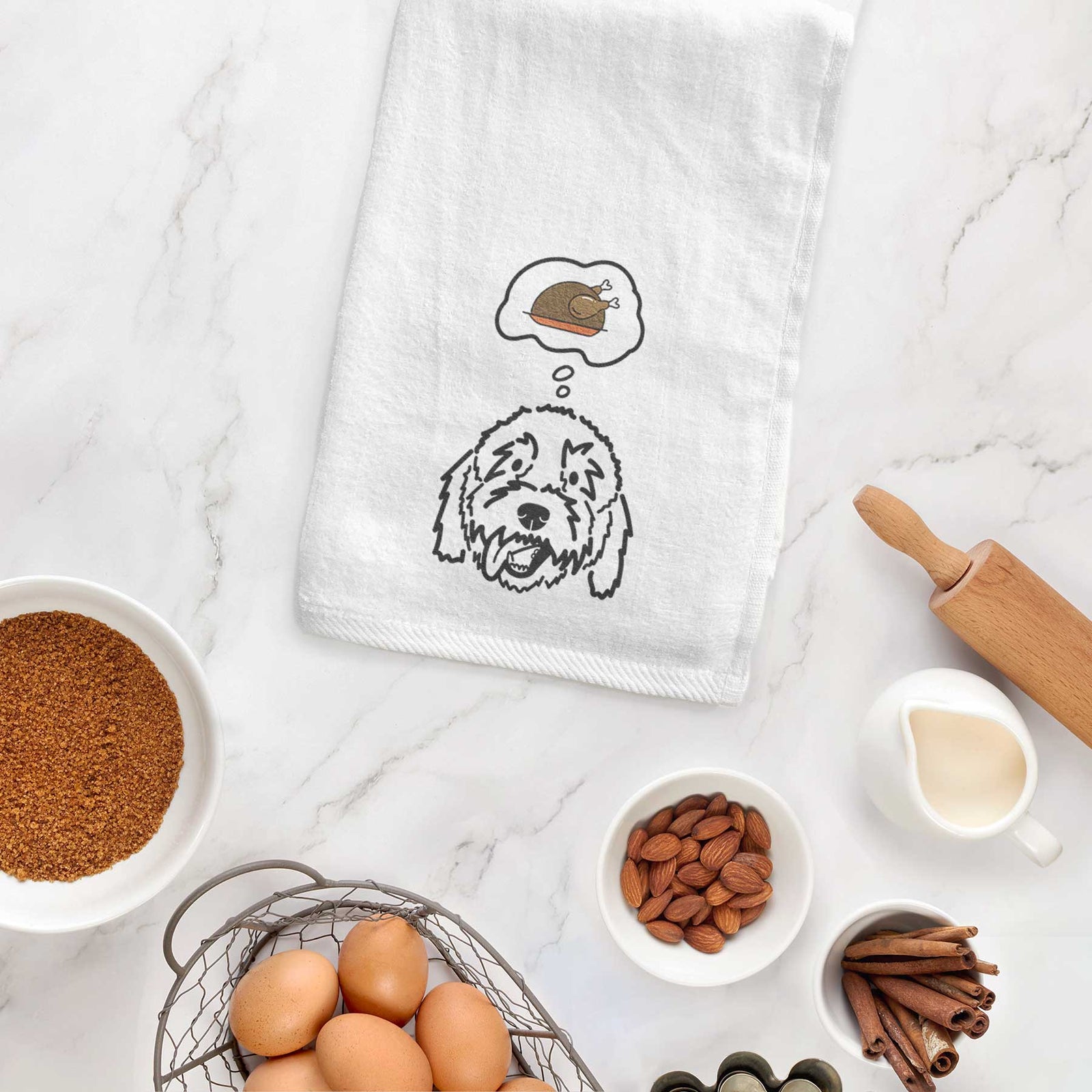 Minimalist line drawing of Barry the Goldendoodle with a little turkey on a decorative hand towel