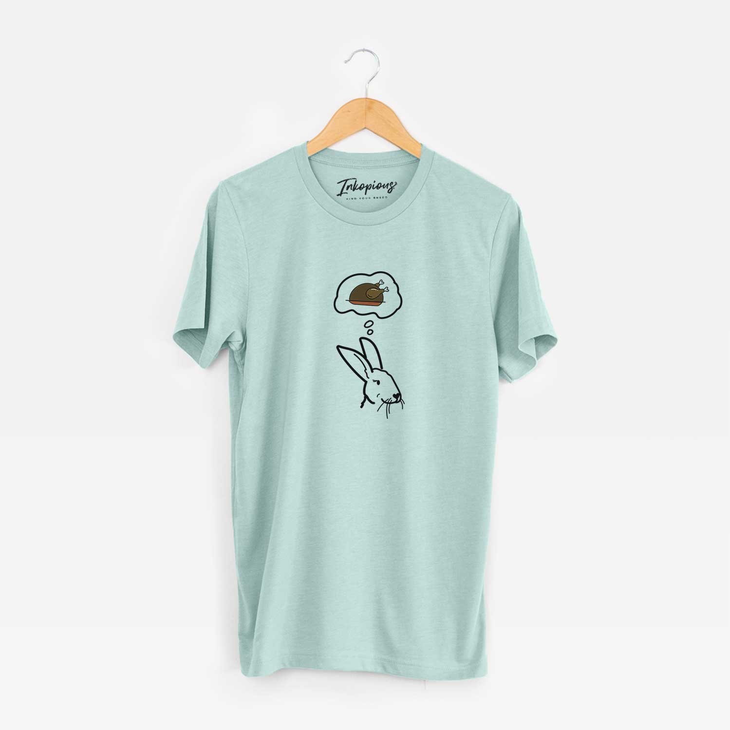 Minimalist line drawing of Betsy the Rex Rabbit with a little turkey on a Heather Sage Unisex crewneck