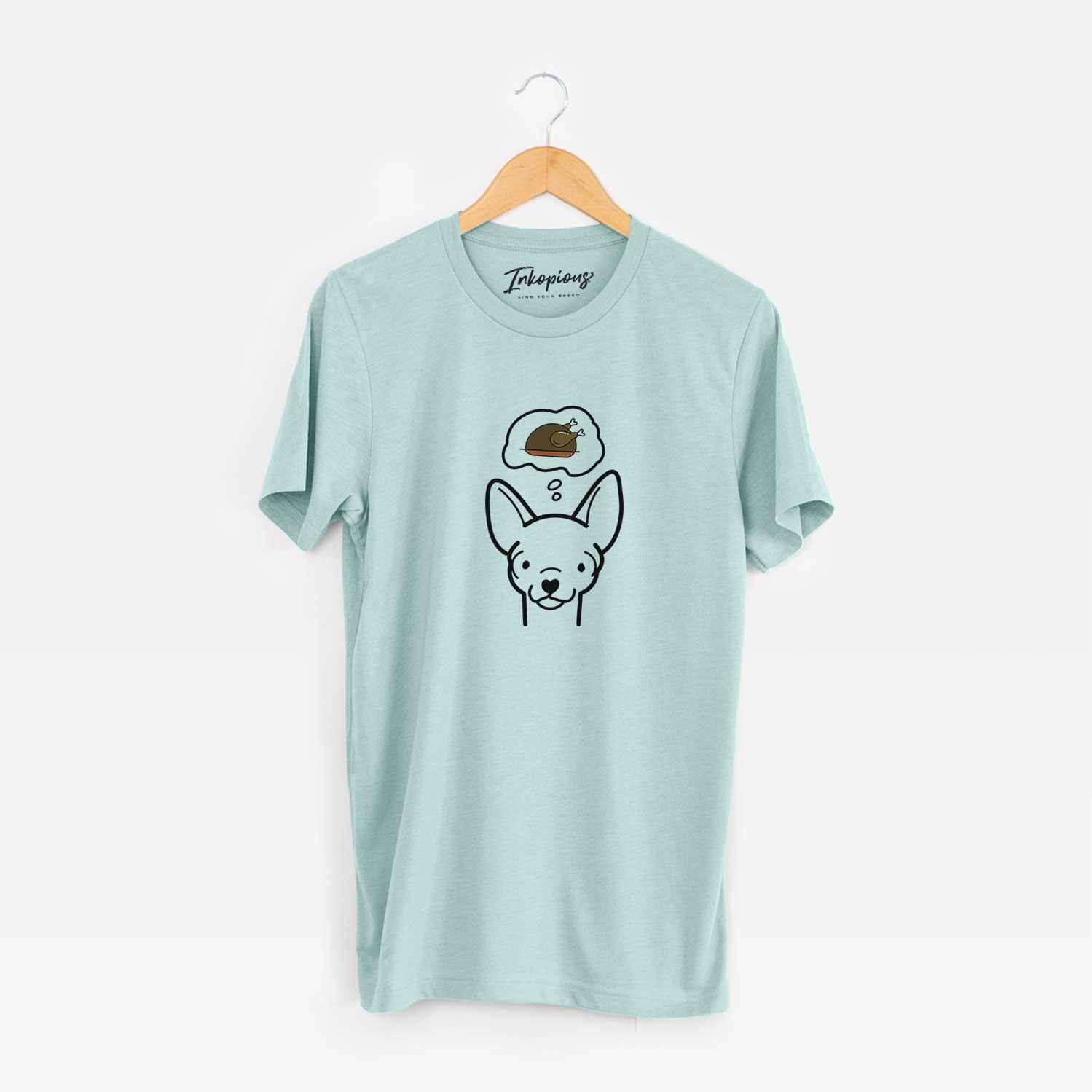 Minimalist line drawing of a Chihuahua with a little turkey on a Heather Sage Unisex crewneck