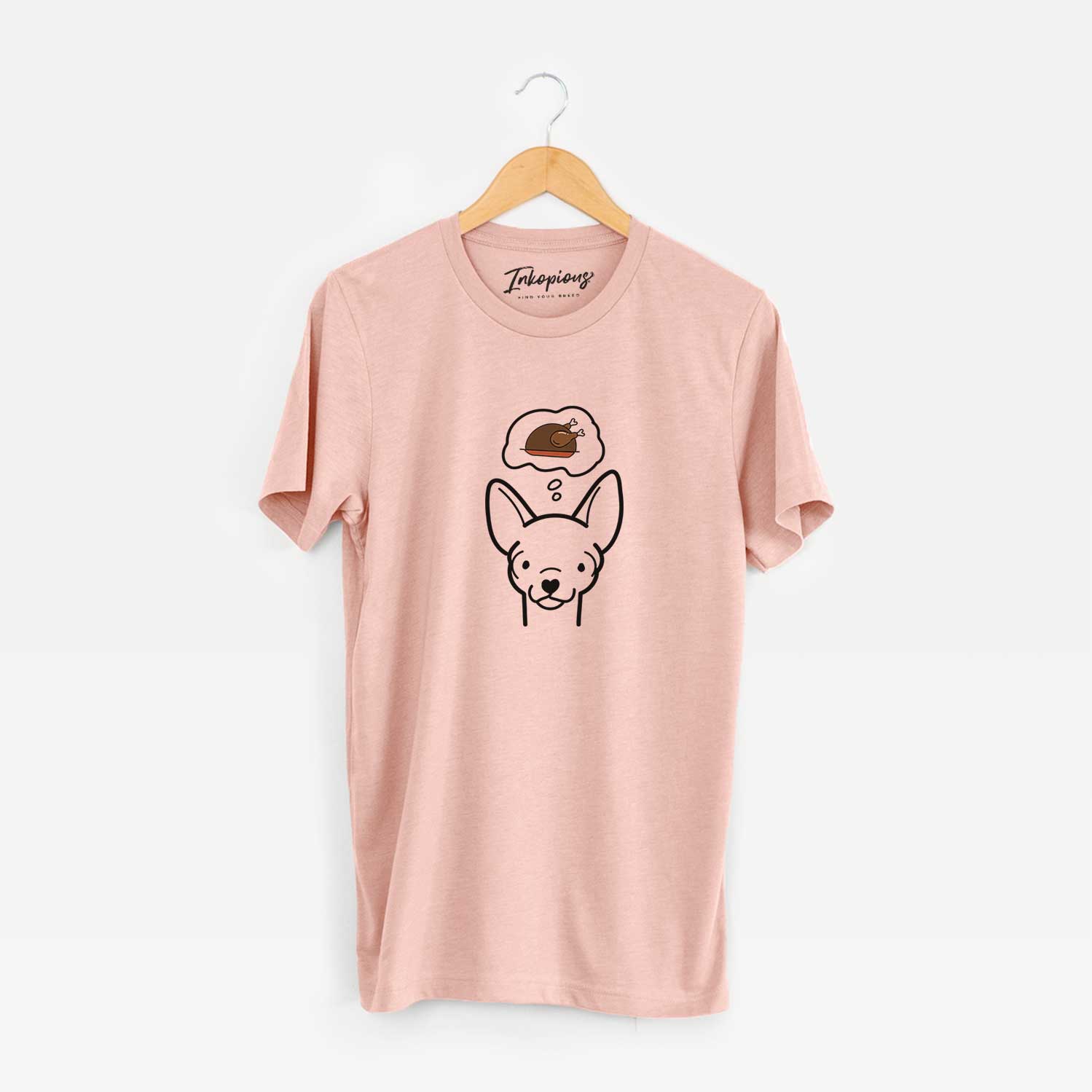 Minimalist line drawing of a Chihuahua with a little turkey on a Peach Unisex crewneck
