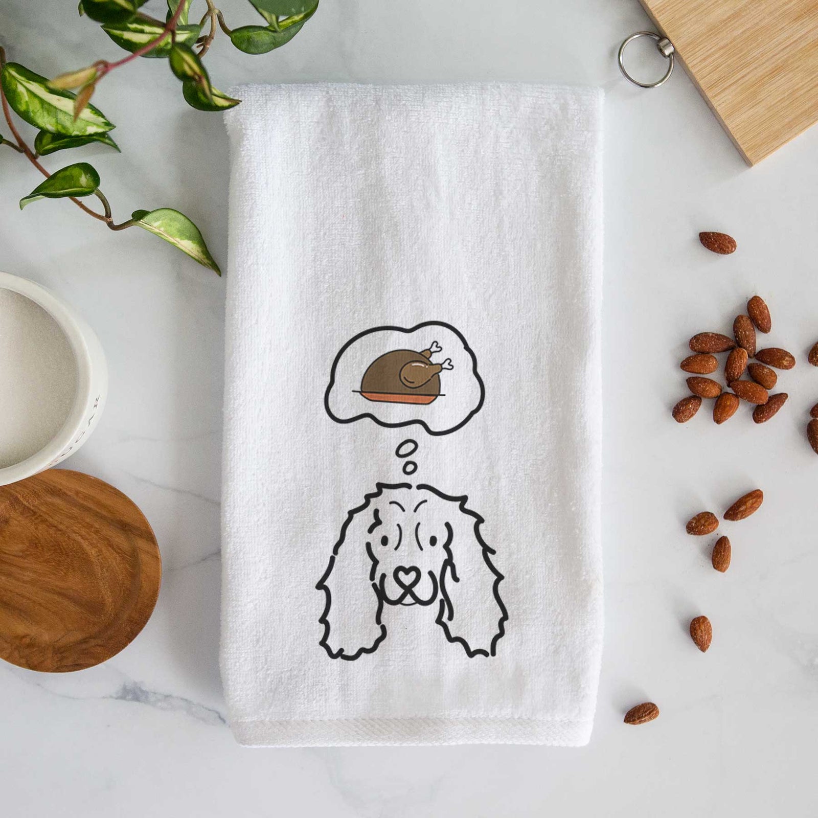 Minimalist line drawing of an American Cocker Spaniel with a little turkey on a decorative hand towel