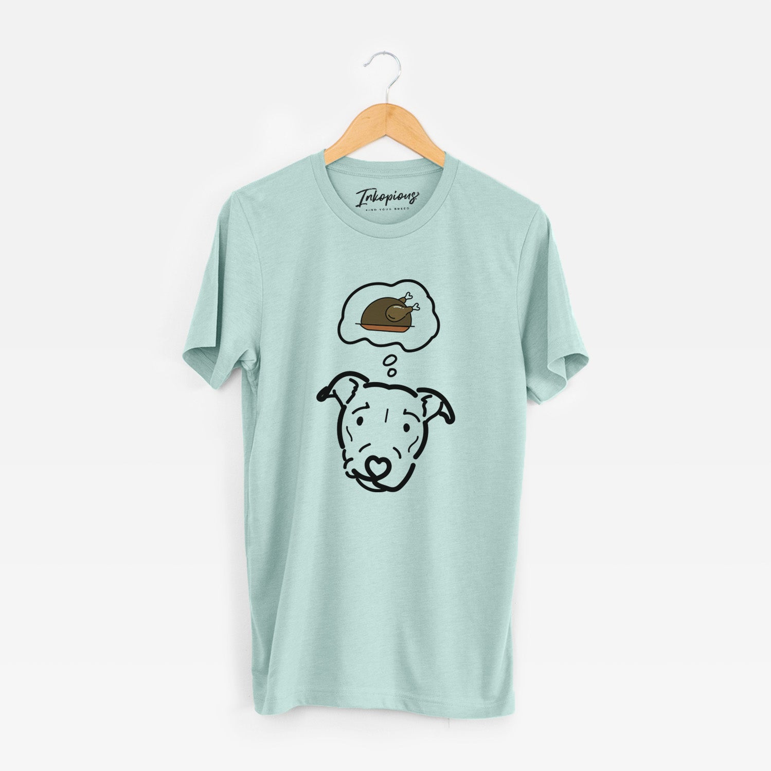 Minimalist line drawing of Ernie the Pitbull Mix with a little turkey on a Heather Sage Unisex crewneck