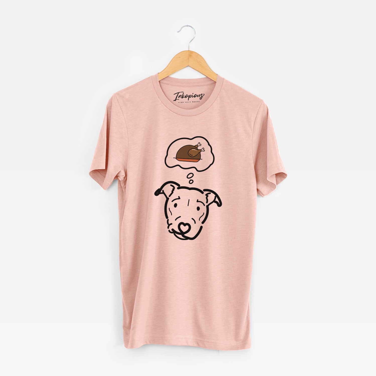 Minimalist line drawing of Ernie the Pitbull Mix with a little turkey on a Peach Unisex crewneck