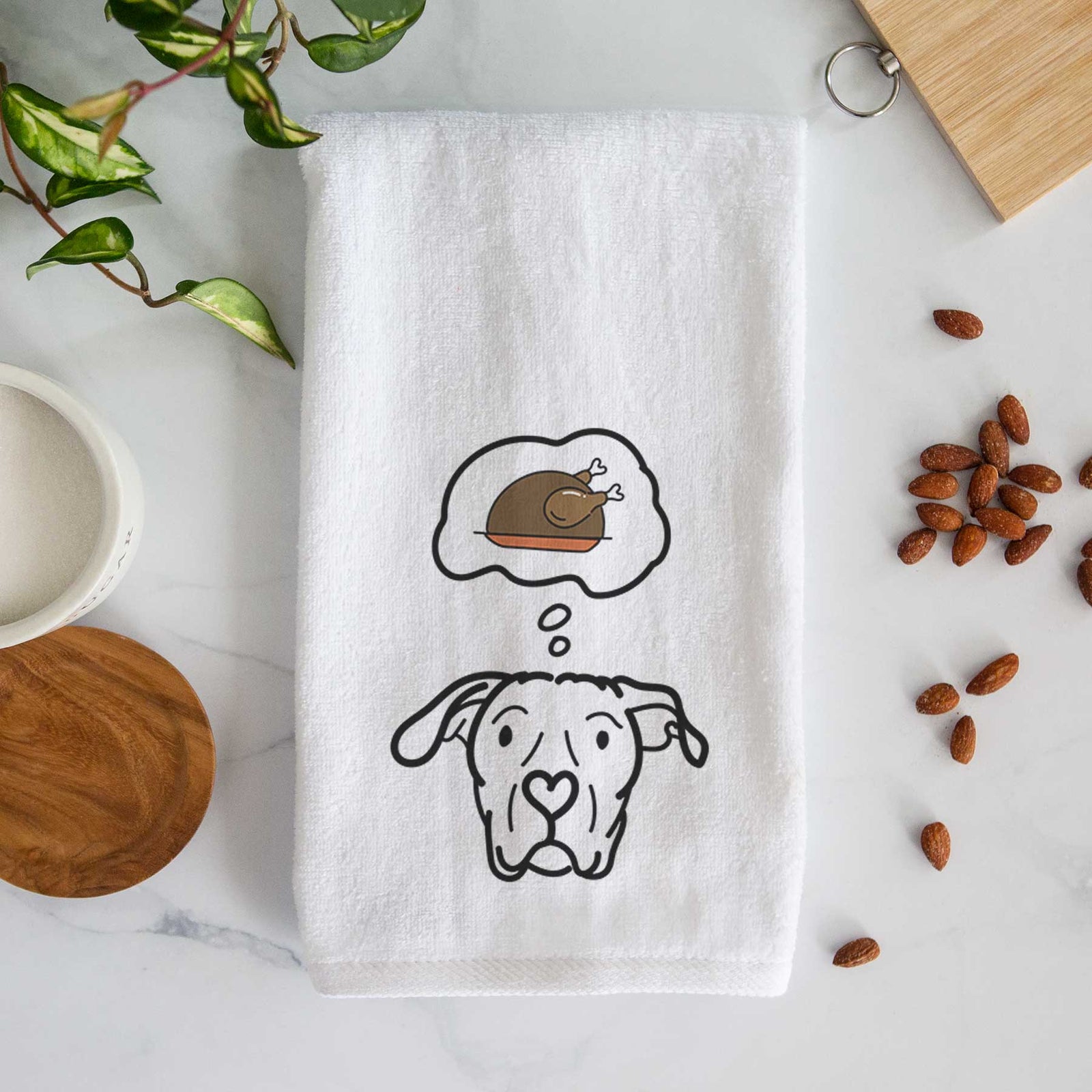 Minimalist line drawing of Genevieve the Dogo Argentino with a little turkey on a decorative hand towel