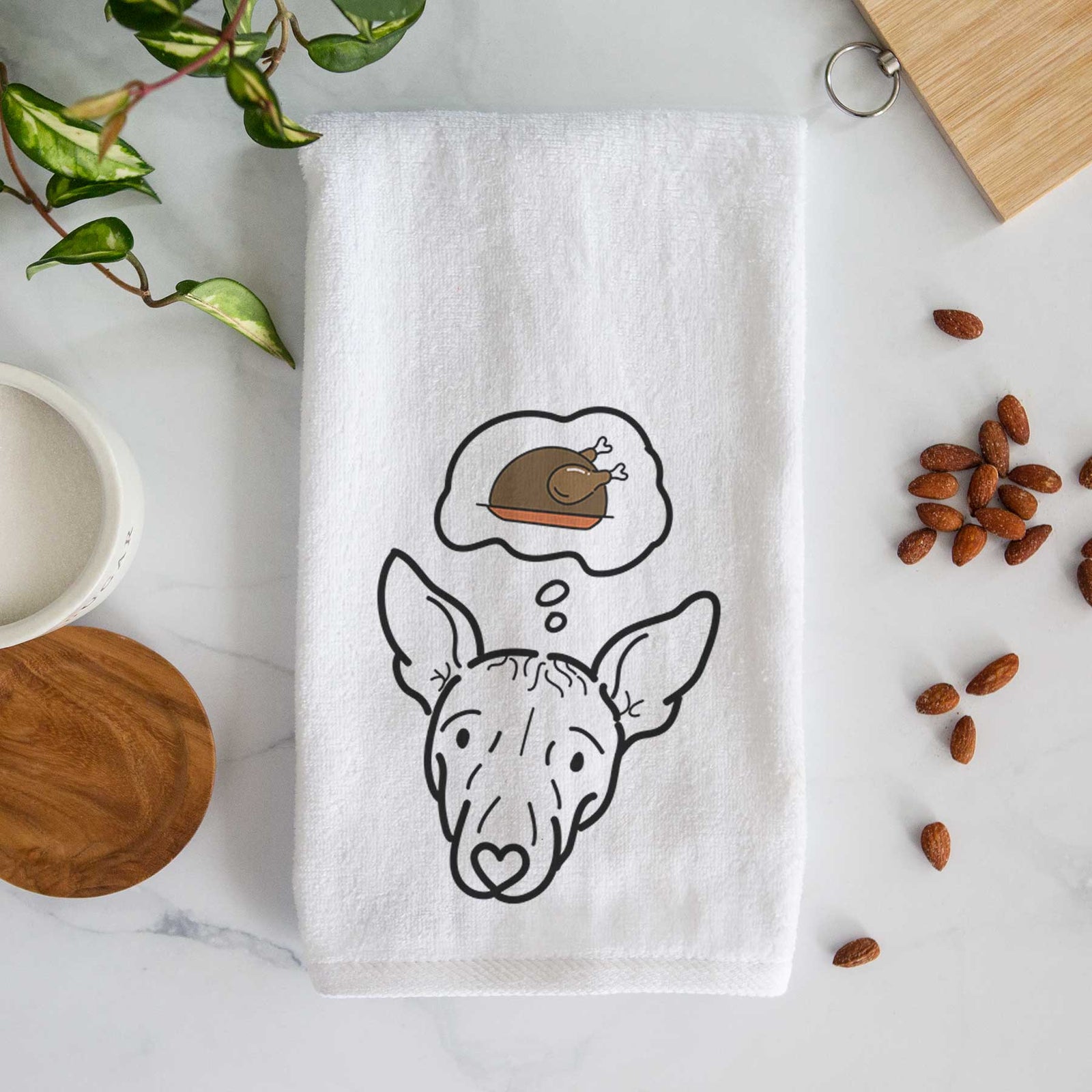Minimalist line drawing of Georgia the American Hairless Terrier with a little turkey on a decorative hand towel