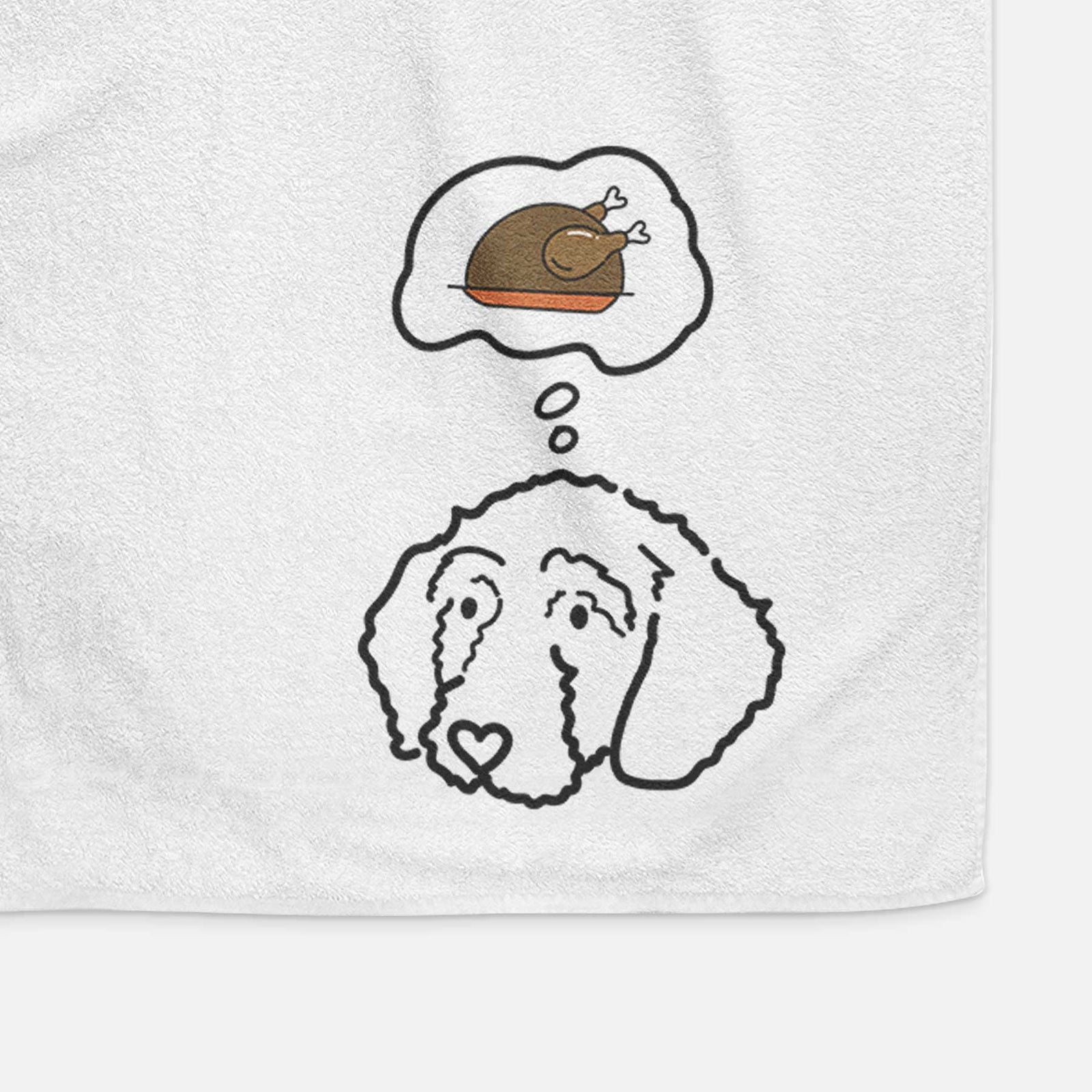 Minimalist line drawing of Hanna the Goldendoodle with a little turkey on a decorative hand towel