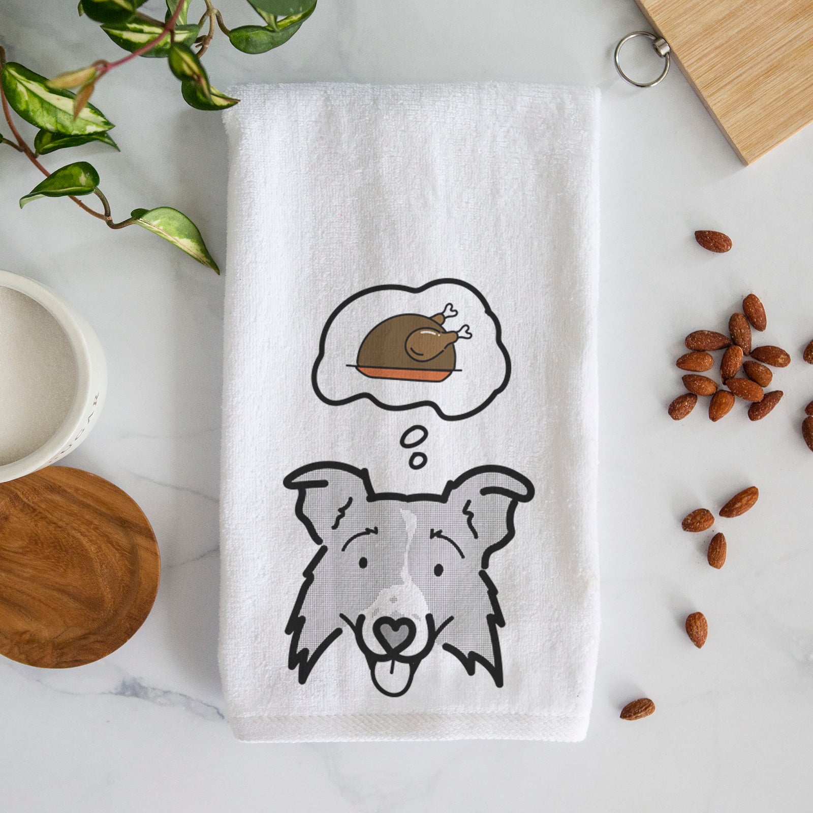 Minimalist line drawing of Jam the Border Collie 2.0 with a little turkey on a decorative hand towel