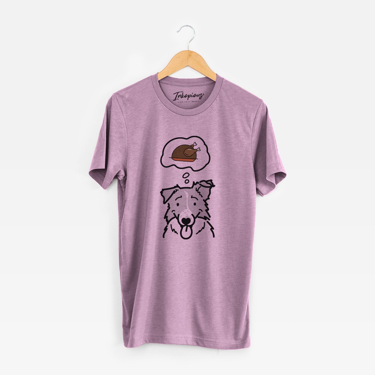 Minimalist line drawing of Jam the Border Collie with a little turkey on an Orchid Unisex crewneck