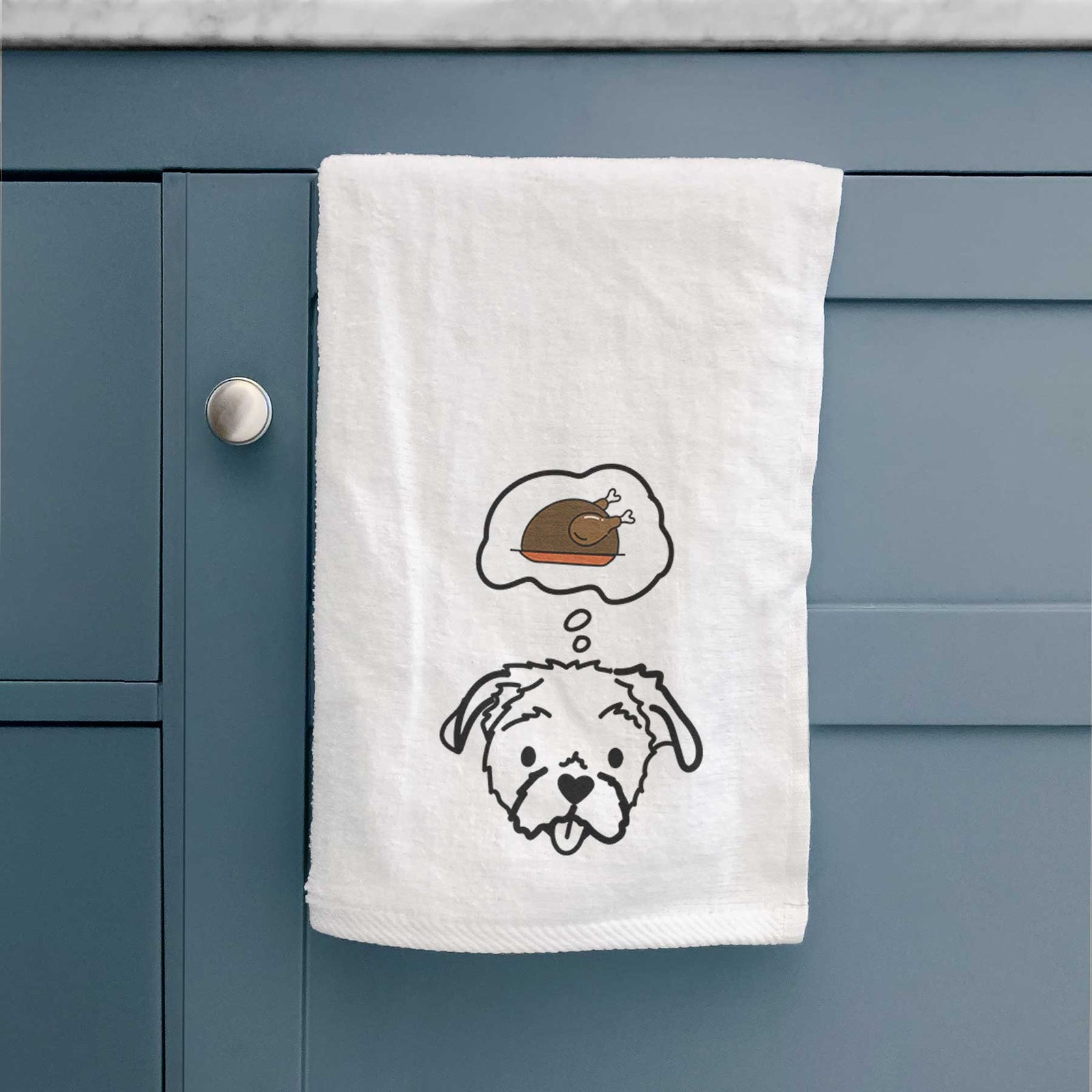 Minimalist line drawing of Koko the Shih Tzu with a little turkey on a decorative hand towel