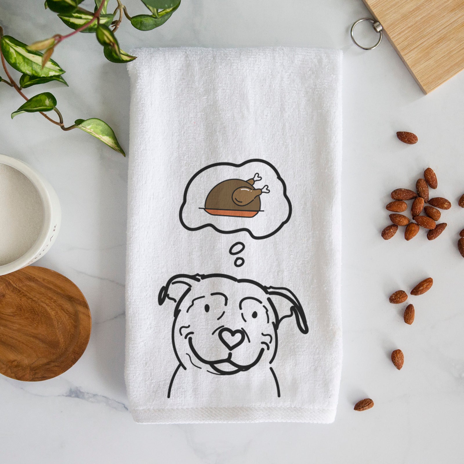 Minimalist line drawing of Lady the American Pitbull Terrier with a little turkey on a decorative hand towel