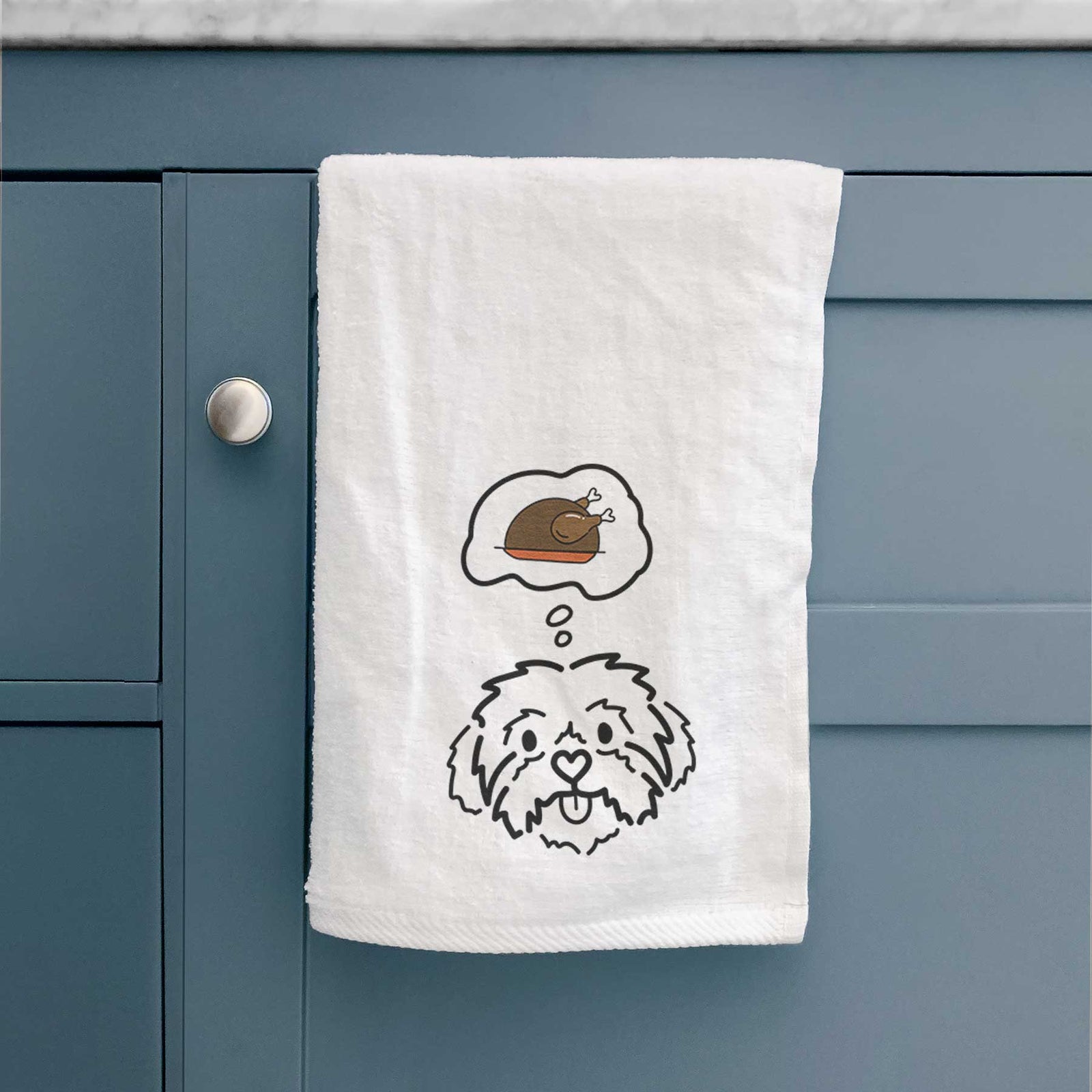 Minimalist line drawing of Leo the Shih Tzu with a little turkey on a decorative hand towel