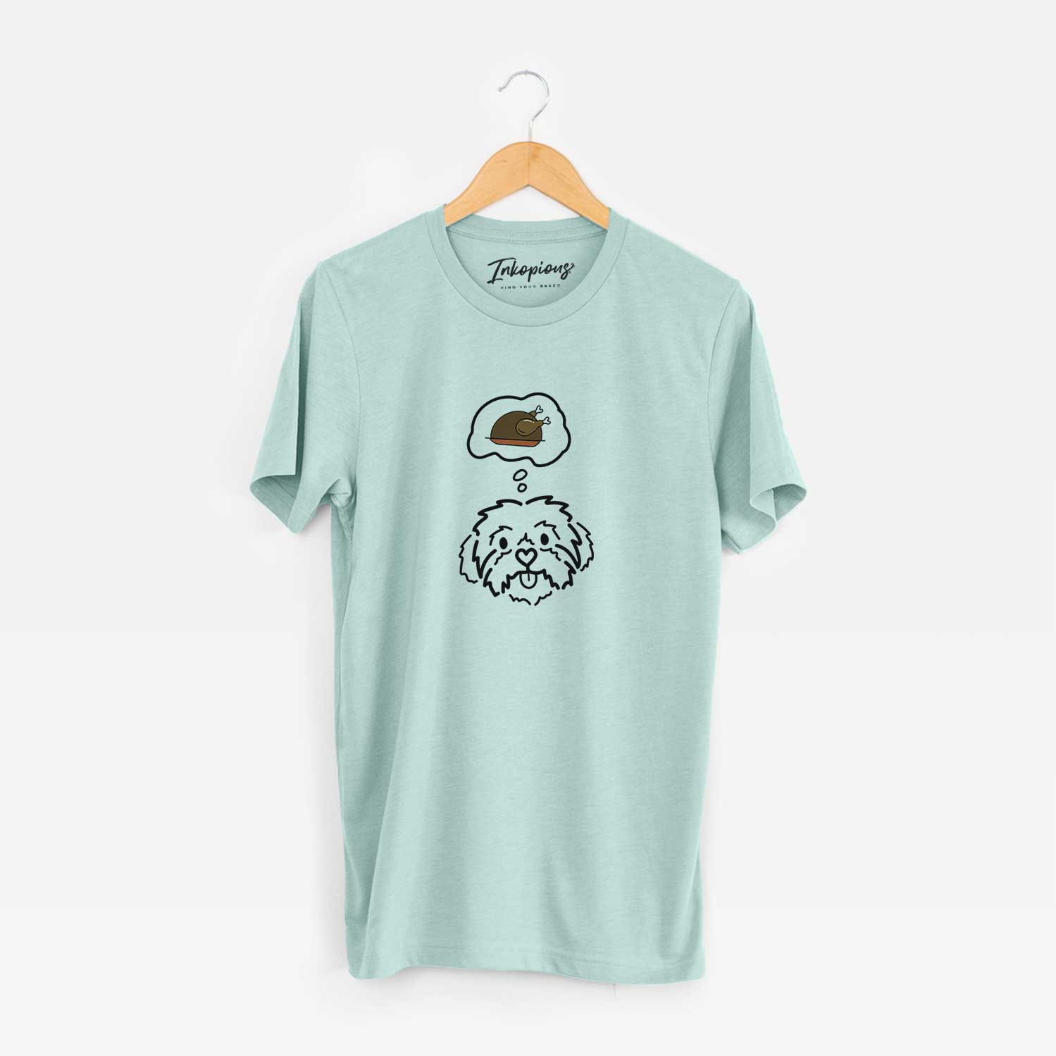 Minimalist line drawing of Leo the Shih Tzu with a little turkey on a Heather Sage Unisex crewneck