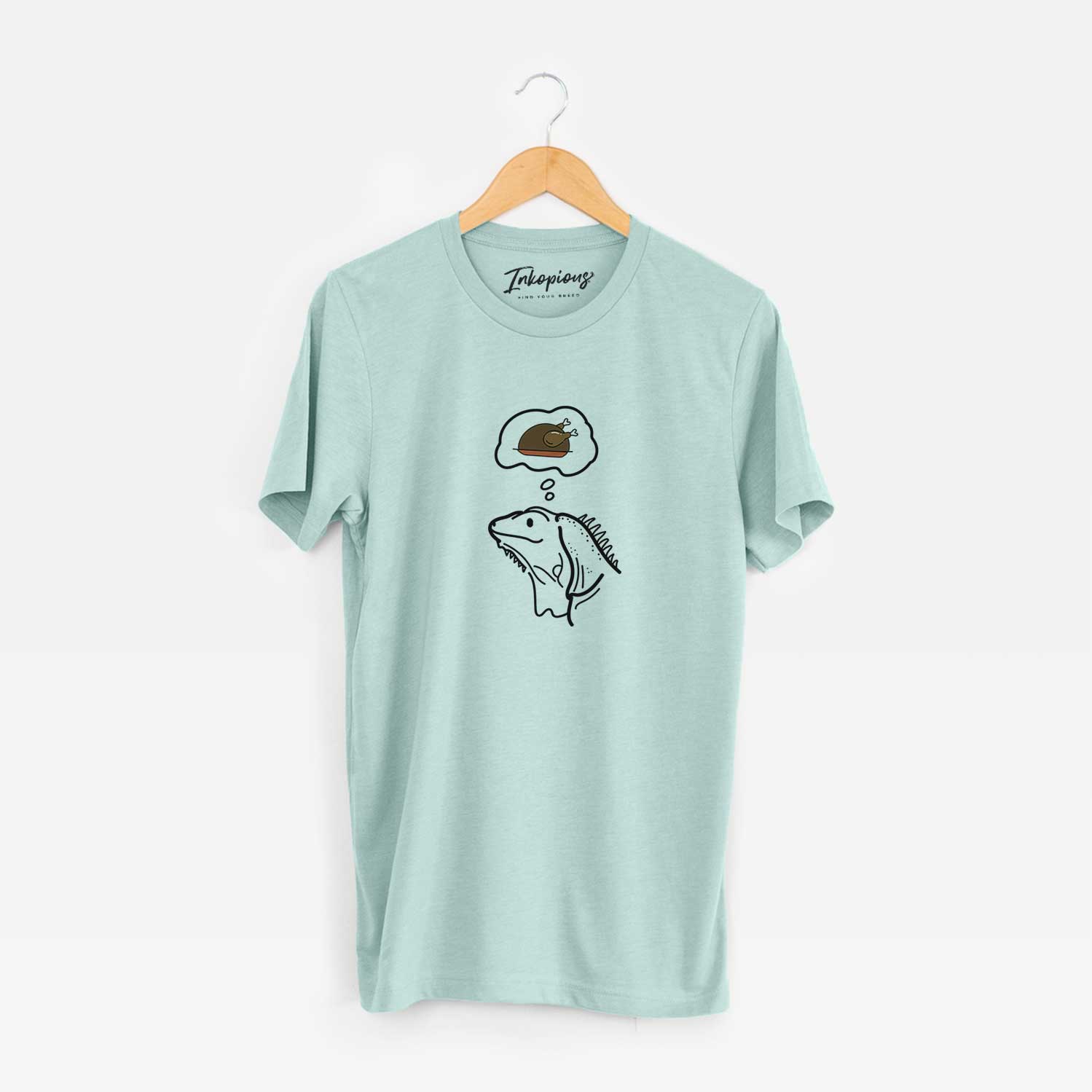 Minimalist line drawing of Louie the Iguana with a little turkey on a Heather Sage Unisex crewneck