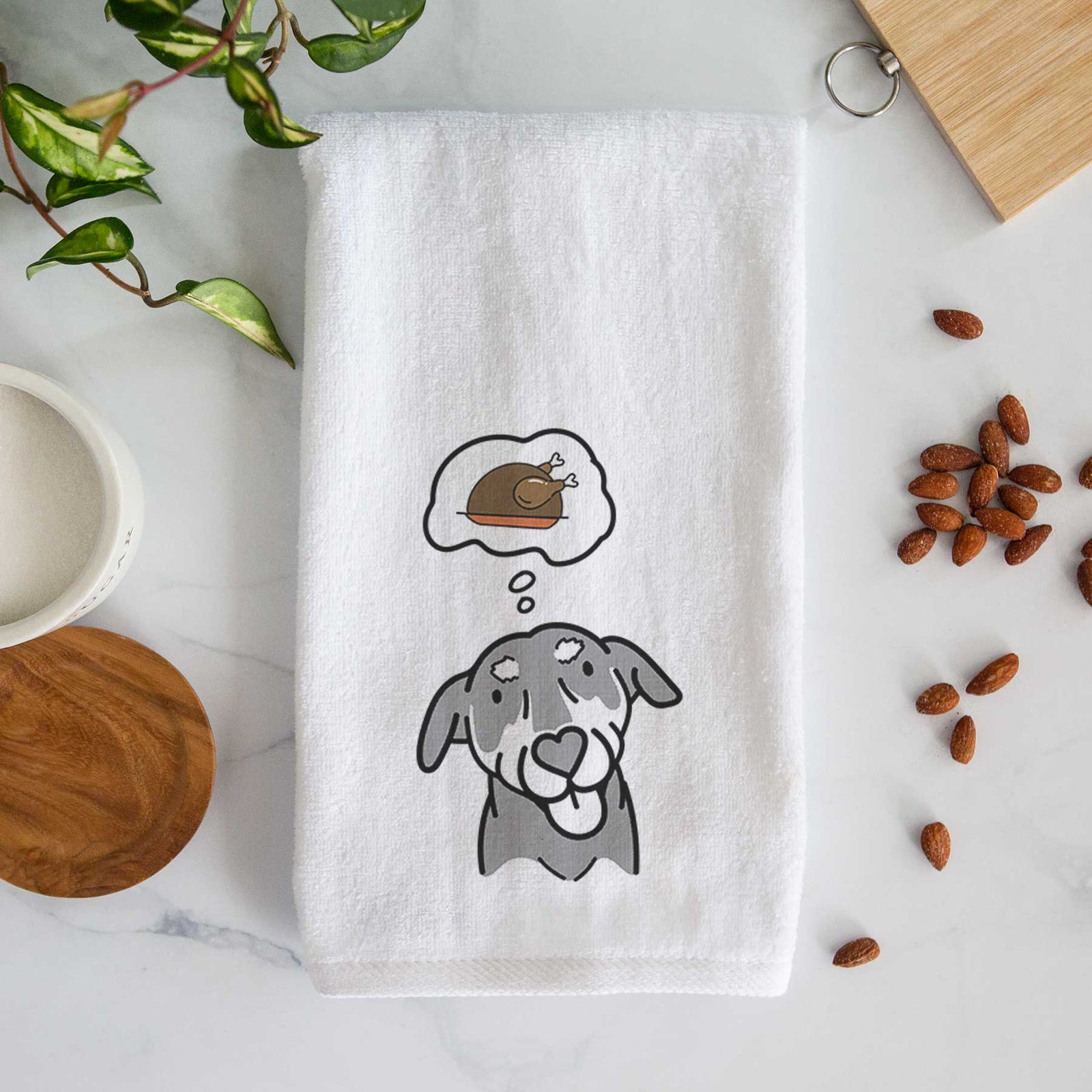 Minimalist line drawing of Lousia the Mixed Breed with a little turkey on a decorative hand towel