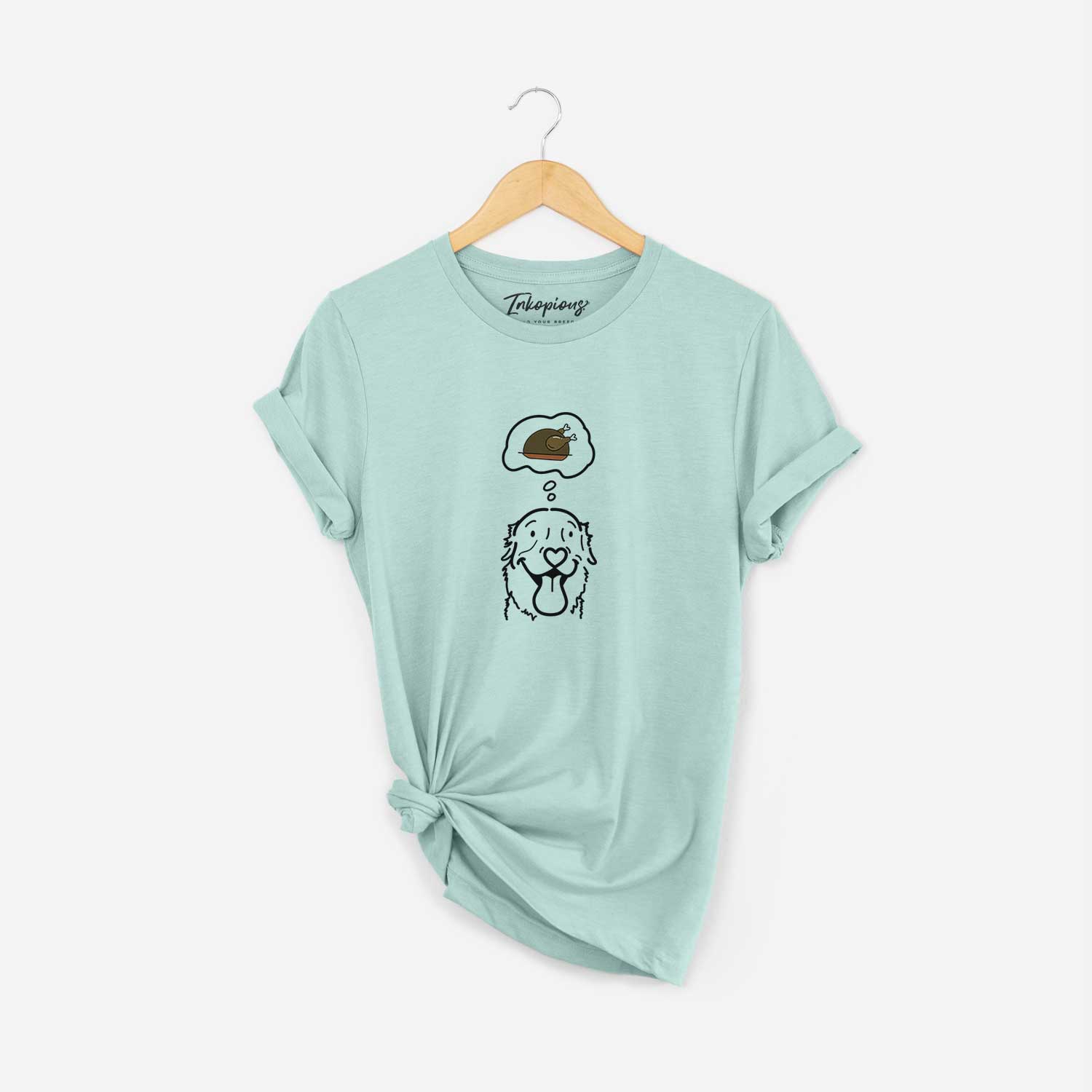 Minimalist line drawing of Maple the Golden Retriever with a little turkey on a Heather Sage Unisex crewneck