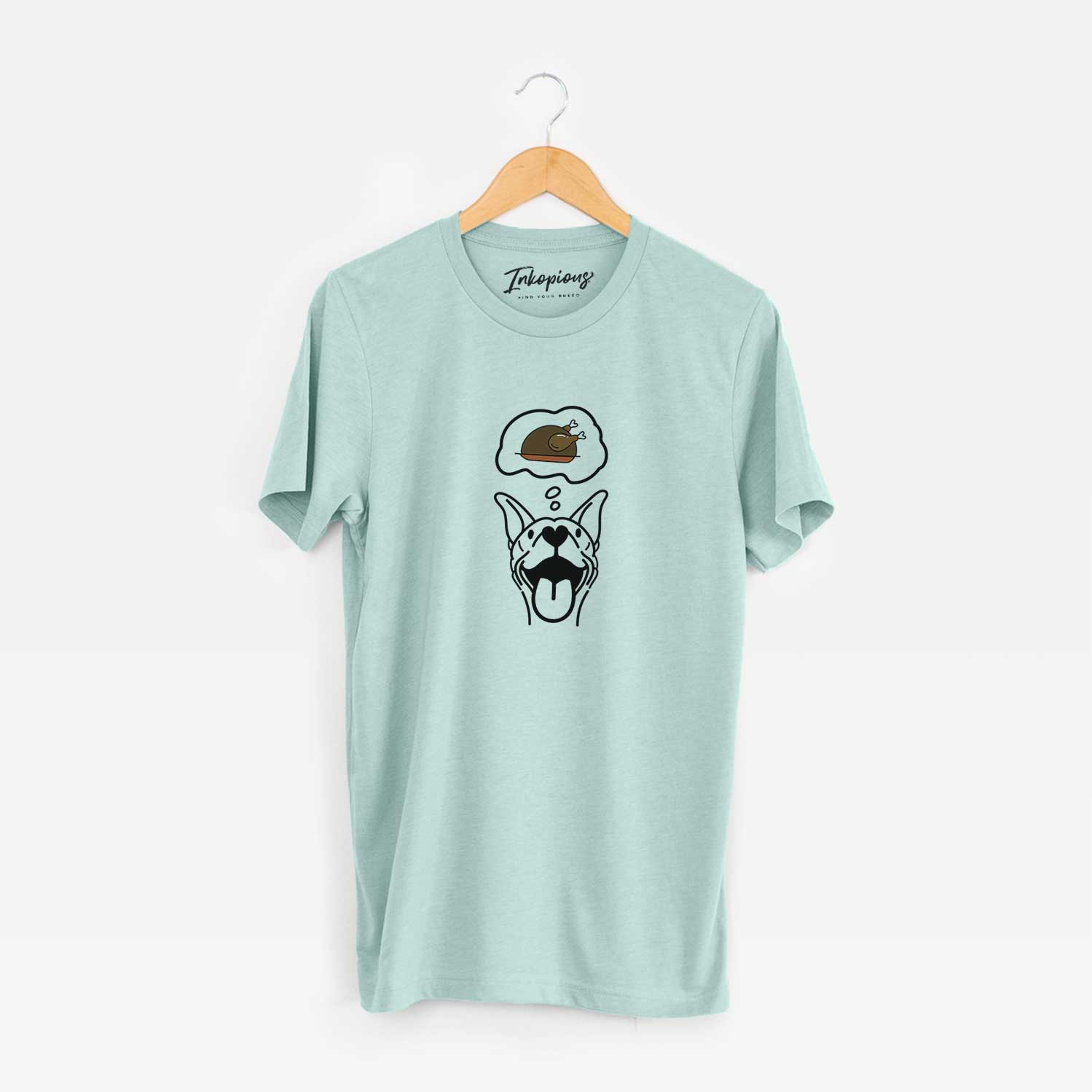 Minimalist line drawing of Merlin the Basenji with a little turkey on a Heather Sage Unisex crewneck