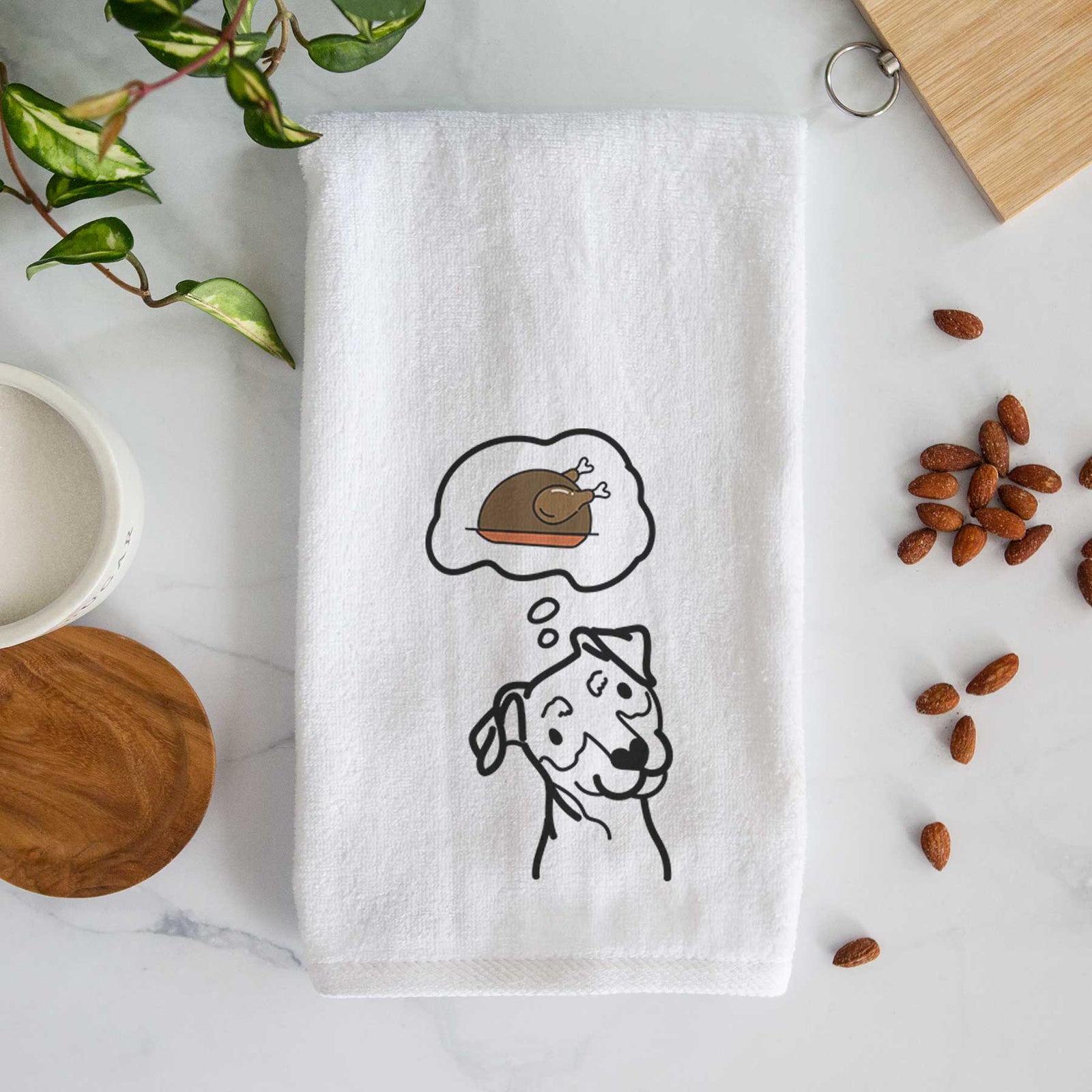 Minimalist line drawing of a Mini Pinscher with a little turkey on a decorative hand towel