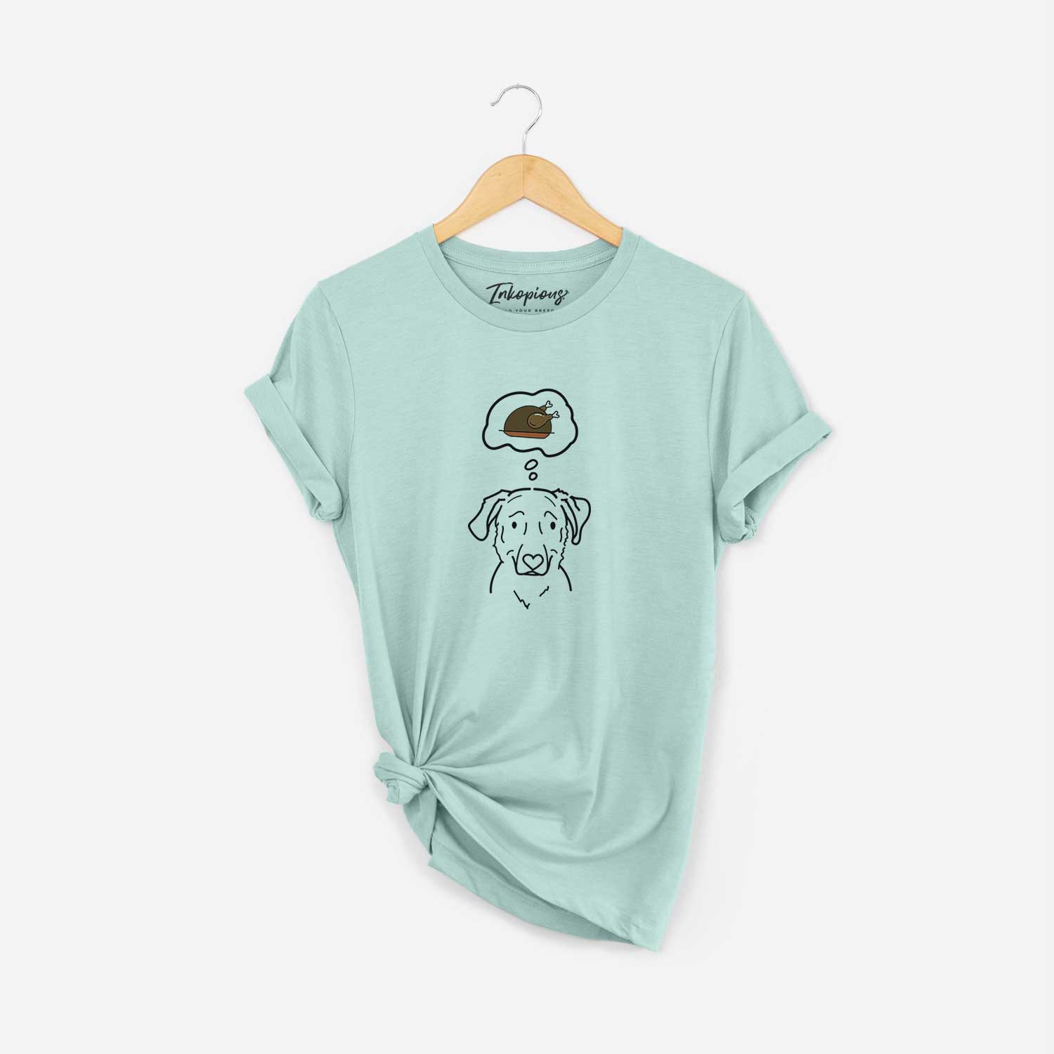 Minimalist line drawing of Mitzi the Golden Retriever Mix with a little turkey on a Heather Sage Unisex crewneck