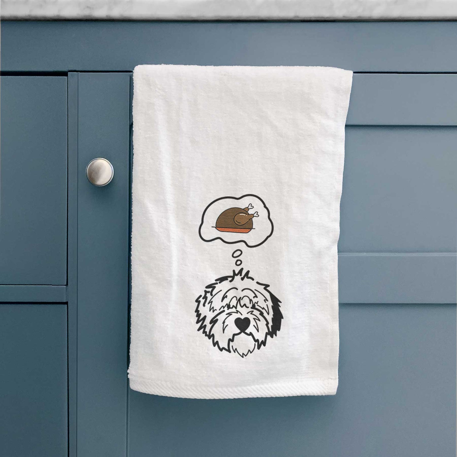 Minimalist line drawing of Penny the Old English Sheepdog with a little turkey on a decorative hand towel