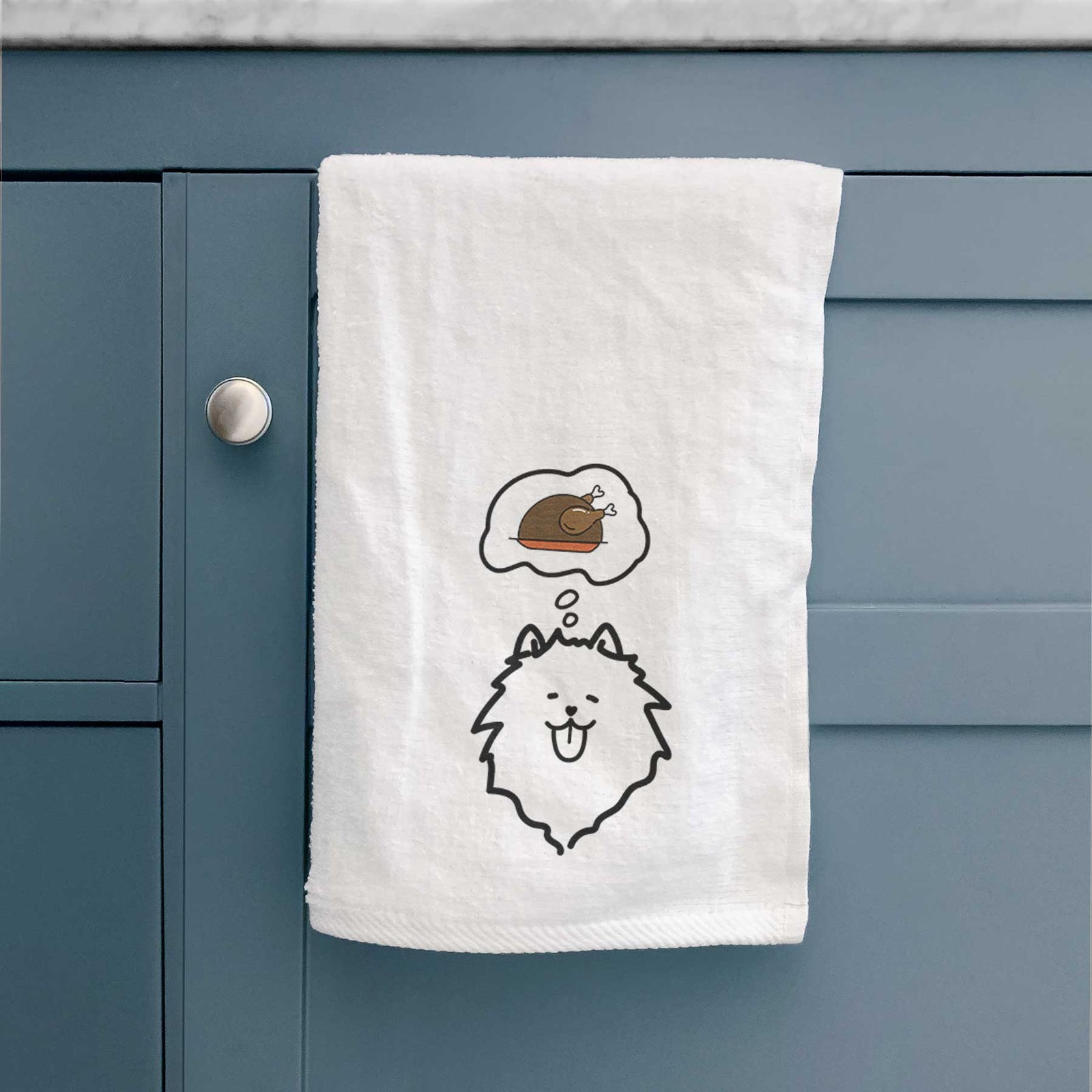Minimalist line drawing of a Pomeranian with a little turkey on a decorative hand towel